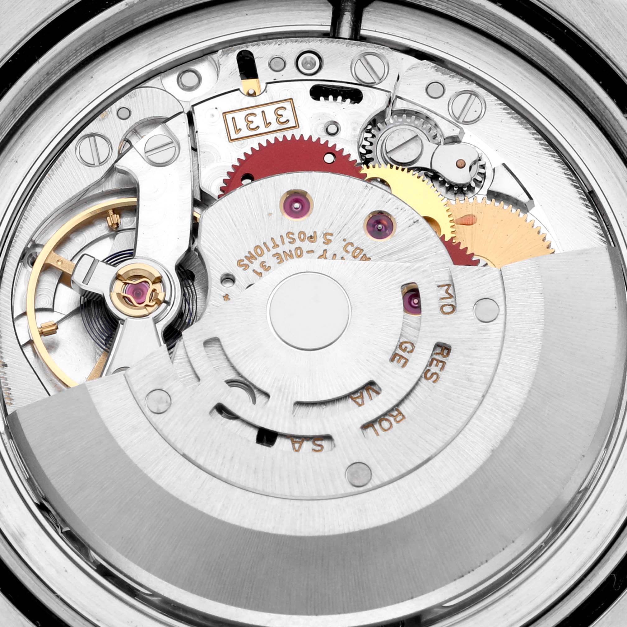 The image shows a close-up view of the movement mechanism of the Rolex Milgauss 116400 Men's Stainless Steel White Dial 116400 Men's Stainless Steel White Dial watch, highlighting gears and internal components.