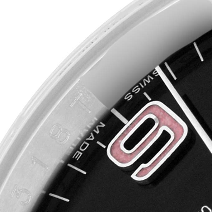 This image shows a close-up of the dial and bezel of a Rolex Oyster Perpetual 116000 Men
s Stainless Steel Black Dial 116000 Men
s Stainless Steel Black Dial watch, focused on the 9 o
clock marker.