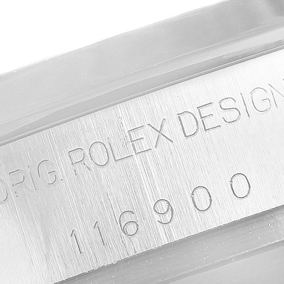 The image shows an extreme close-up of the Rolex Air-King 116900 Men's Stainless Steel Black Dial 116900 Men's Stainless Steel Black Dial model's engraved serial number and design details on the case side.