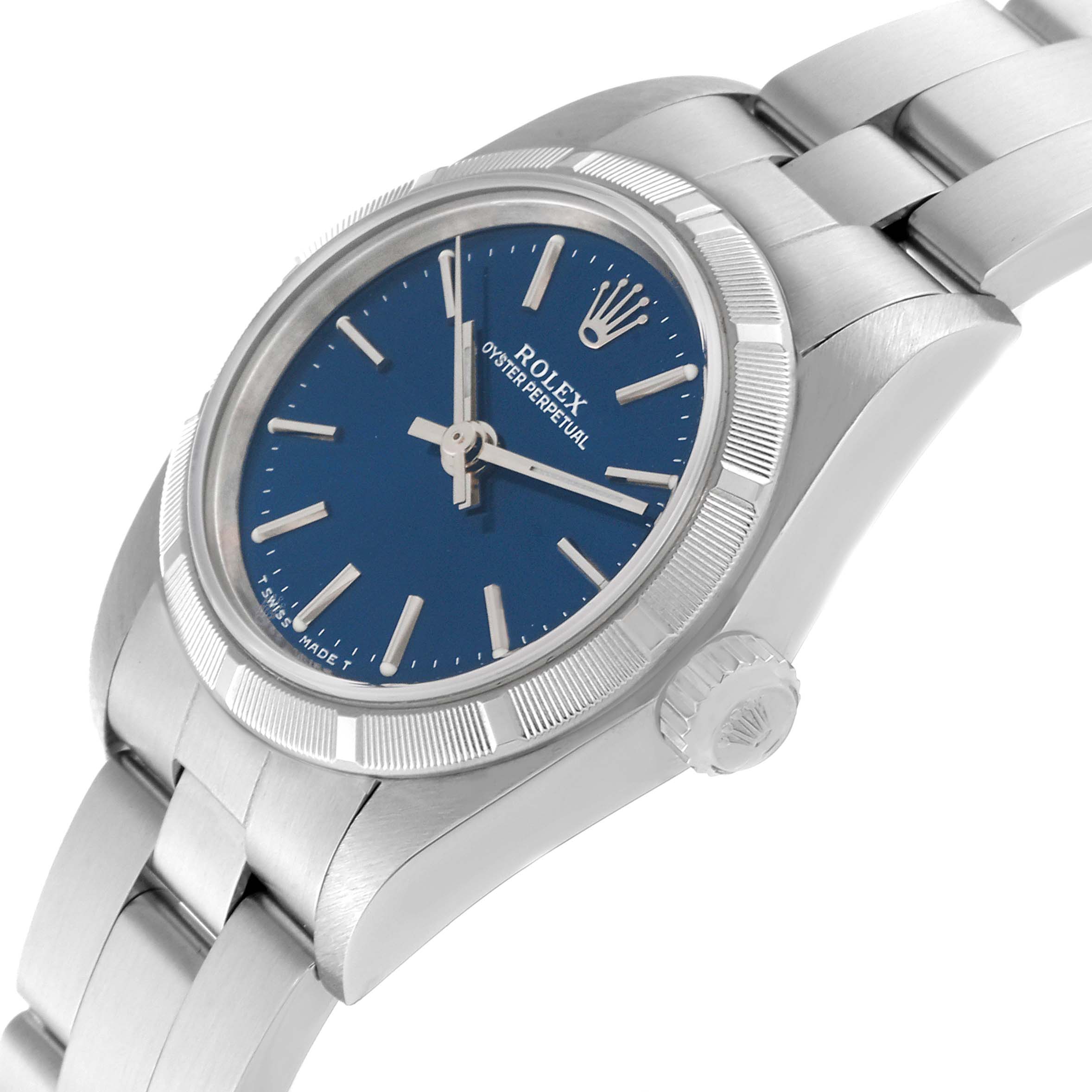 This Rolex Oyster Perpetual 76030 Women's Stainless Steel Blue Dial 76030 Women's Stainless Steel Blue Dial watch is shown at an angle highlighting the face, bezel, crown, and part of the bracelet.