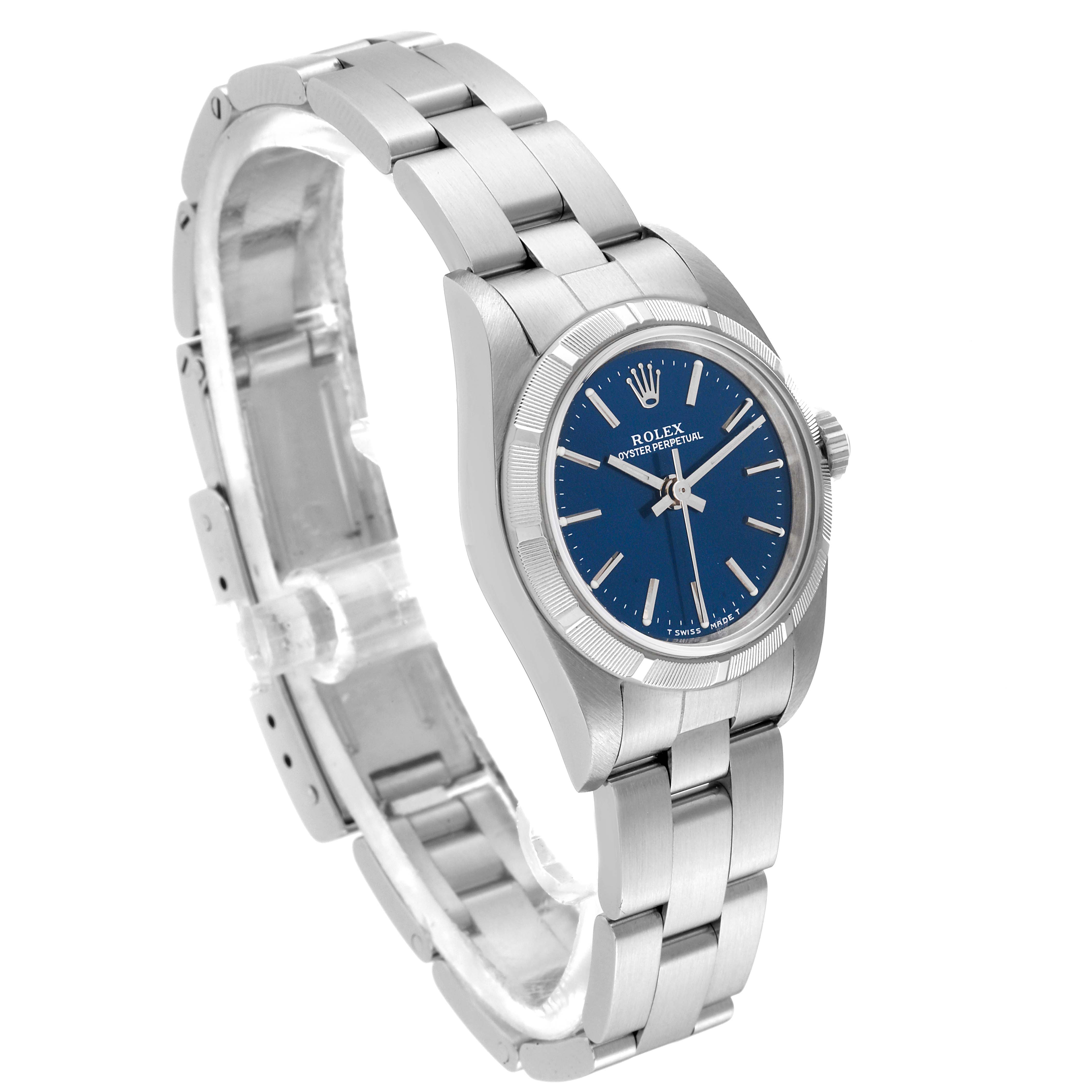 The Rolex Oyster Perpetual 76030 Women's Stainless Steel Blue Dial 76030 Women's Stainless Steel Blue Dial watch is shown at a three-quarter angle, displaying the blue dial, bezel, and stainless steel bracelet.
