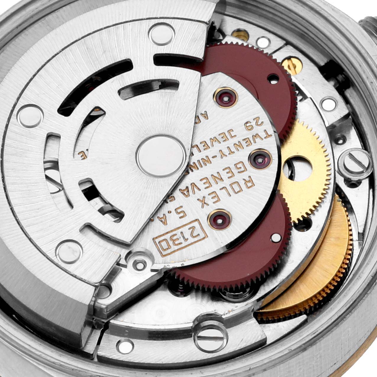 This image shows the detailed inner mechanism of a Rolex Oyster Perpetual 67243 Women's Steel and Gold (two tone) Champagne Dial 67243 Women's Steel and Gold (two tone) Champagne Dial model watch, highlighting gears and the rotor.