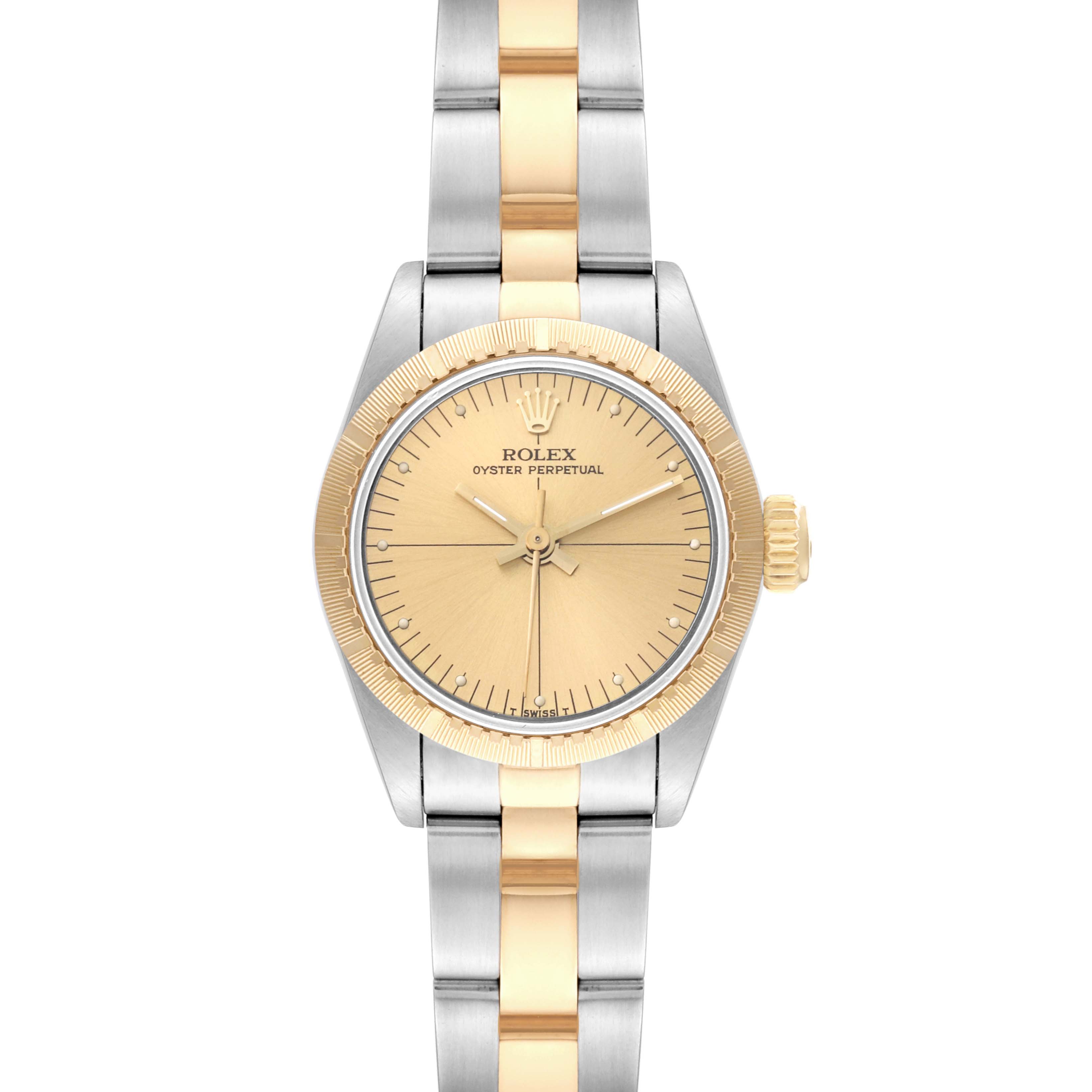 This image shows a Rolex Oyster Perpetual 67243 Women's Steel and Gold (two tone) Champagne Dial 67243 Women's Steel and Gold (two tone) Champagne Dial watch from a front angle, highlighting the bezel, dial, hands, and bracelet.