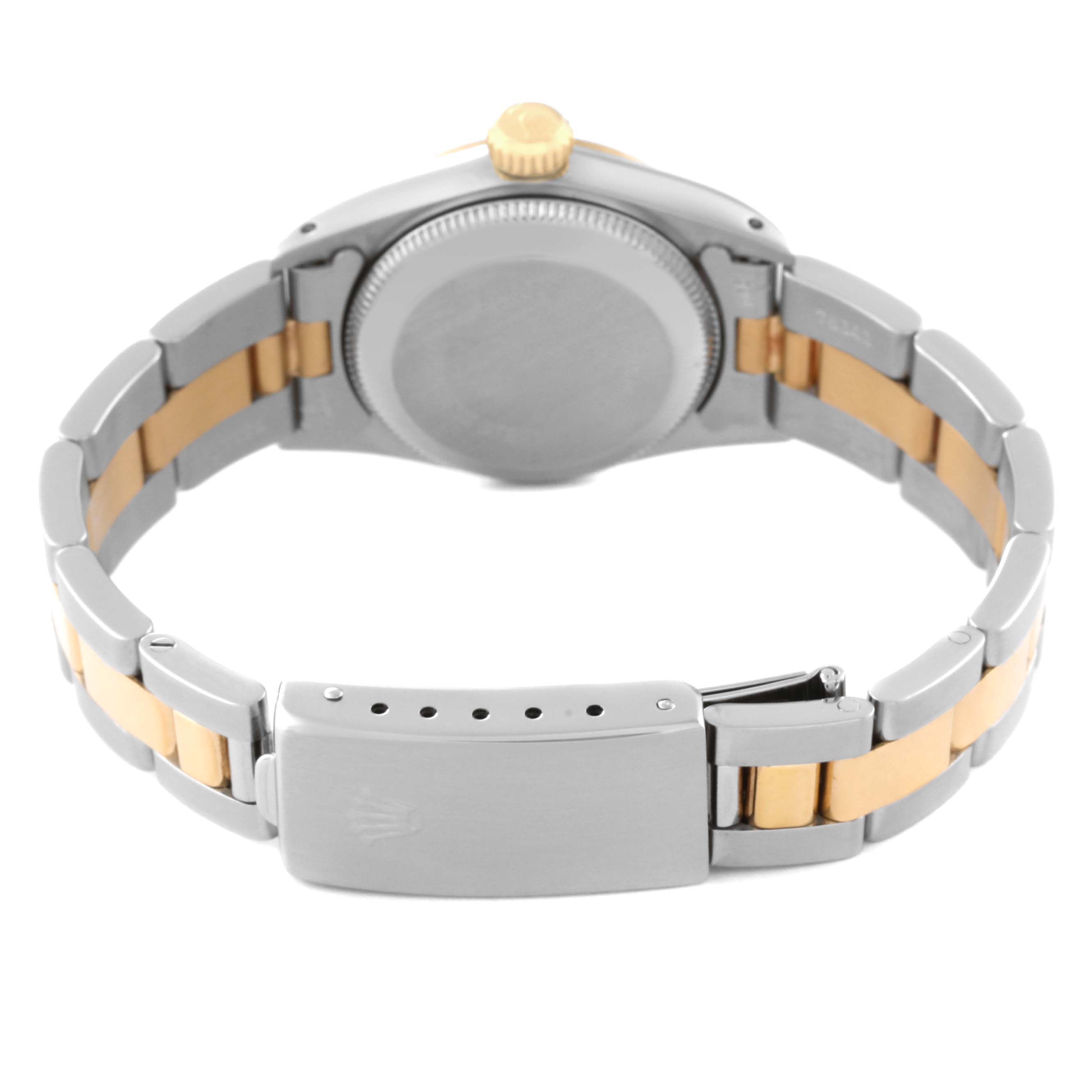 The image shows the back view of a Rolex Oyster Perpetual 67243 Women's Steel and Gold (two tone) Champagne Dial 67243 Women's Steel and Gold (two tone) Champagne Dial watch, highlighting the case, crown, and two-tone bracelet.