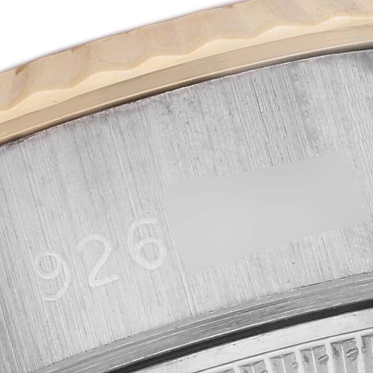 The image shows a close-up of the edge of the bezel and part of the case of a Rolex President 69179 Women's White Gold Champagne Dial 69179 Women's White Gold Champagne Dial model watch.
