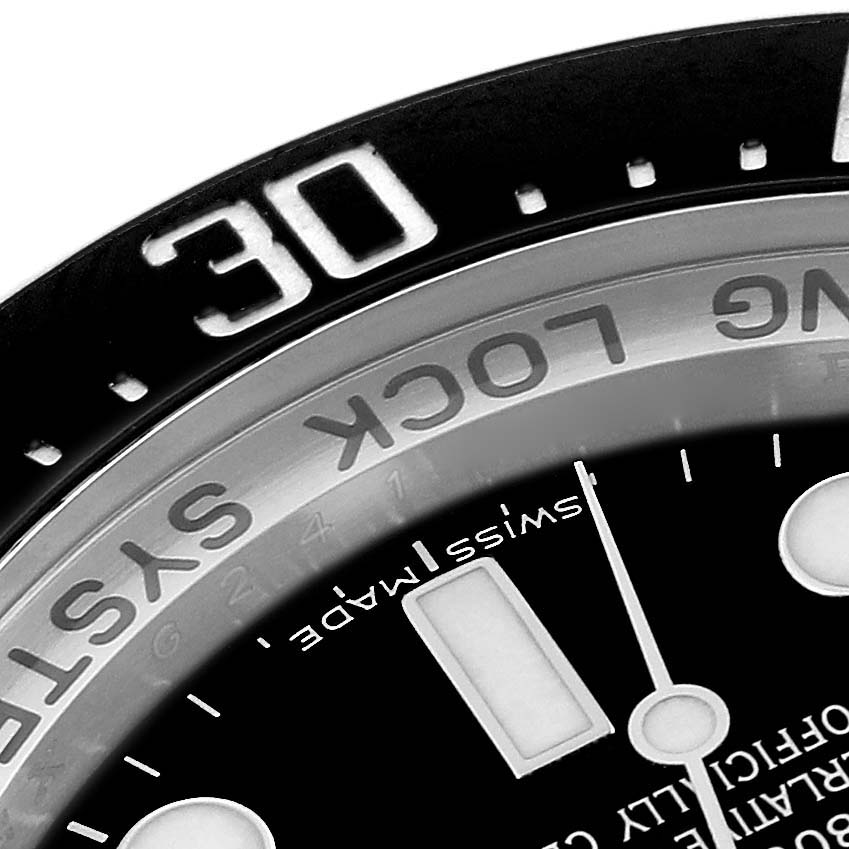 The image shows a close-up of the bezel, dial, and part of the markings on a Rolex Sea-Dweller 116660 Men
s Stainless Steel Black Dial 116660 Men
s Stainless Steel Black Dial watch, highlighting the "30" mark.