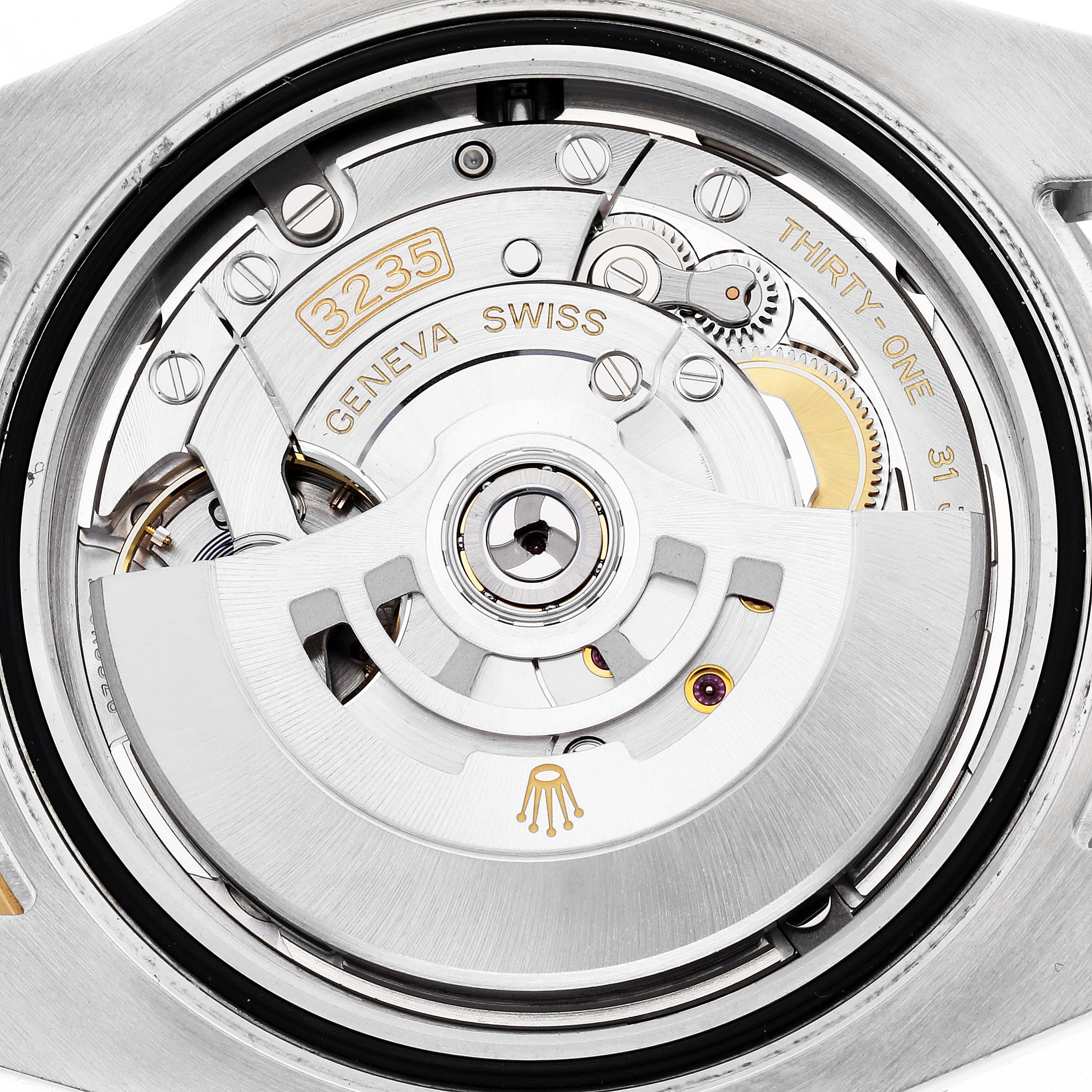 The image shows the movement of a Rolex Submariner 126613LB Men's Steel and Gold (two tone) Blue Dial 126613LB Men's Steel and Gold (two tone) Blue Dial watch, highlighting the inner mechanical components from a rear angle.