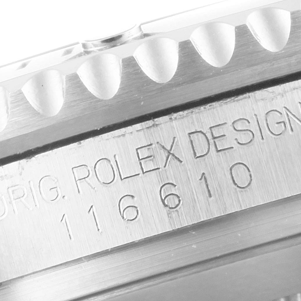 This close-up angle of the Rolex Submariner 116610LN Men
s Stainless Steel Black Dial 116610LN Men
s Stainless Steel Black Dial watch shows the engraved model number 116610 and part of the bezel.