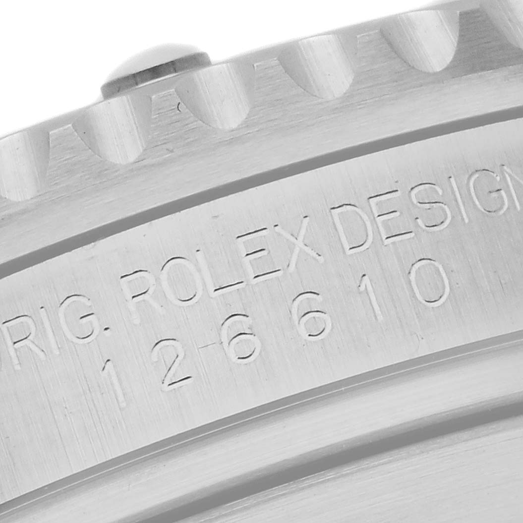 Close-up view of the engraved "ROLEX DESIGN" and serial number on the case side of the Rolex Submariner 126610 Men
s Stainless Steel Black Dial 126610 Men
s Stainless Steel Black Dial.