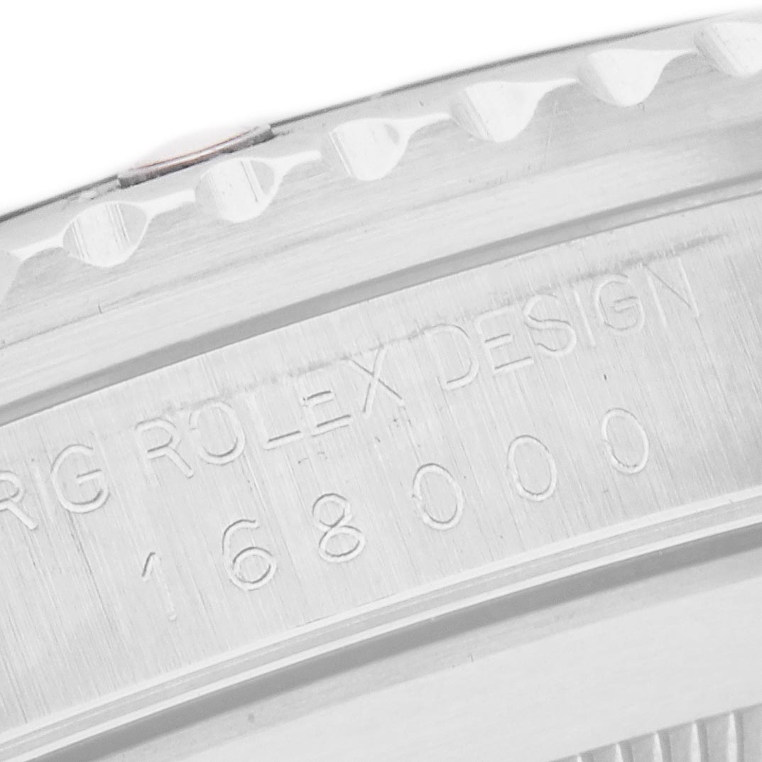 The image shows the engraved case back of a Rolex Submariner 168000 Men
s Stainless Steel Black Dial 168000 Men
s Stainless Steel Black Dial, highlighting the model number and design text.