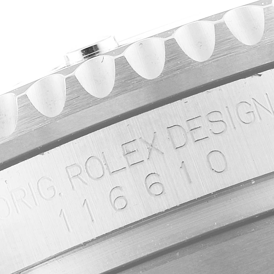 This image shows a close-up of the bezel and engraved serial number on a Rolex Submariner 116610LV Men
s Stainless Steel Green Dial 116610LV Men
s Stainless Steel Green Dial watch model 116610.