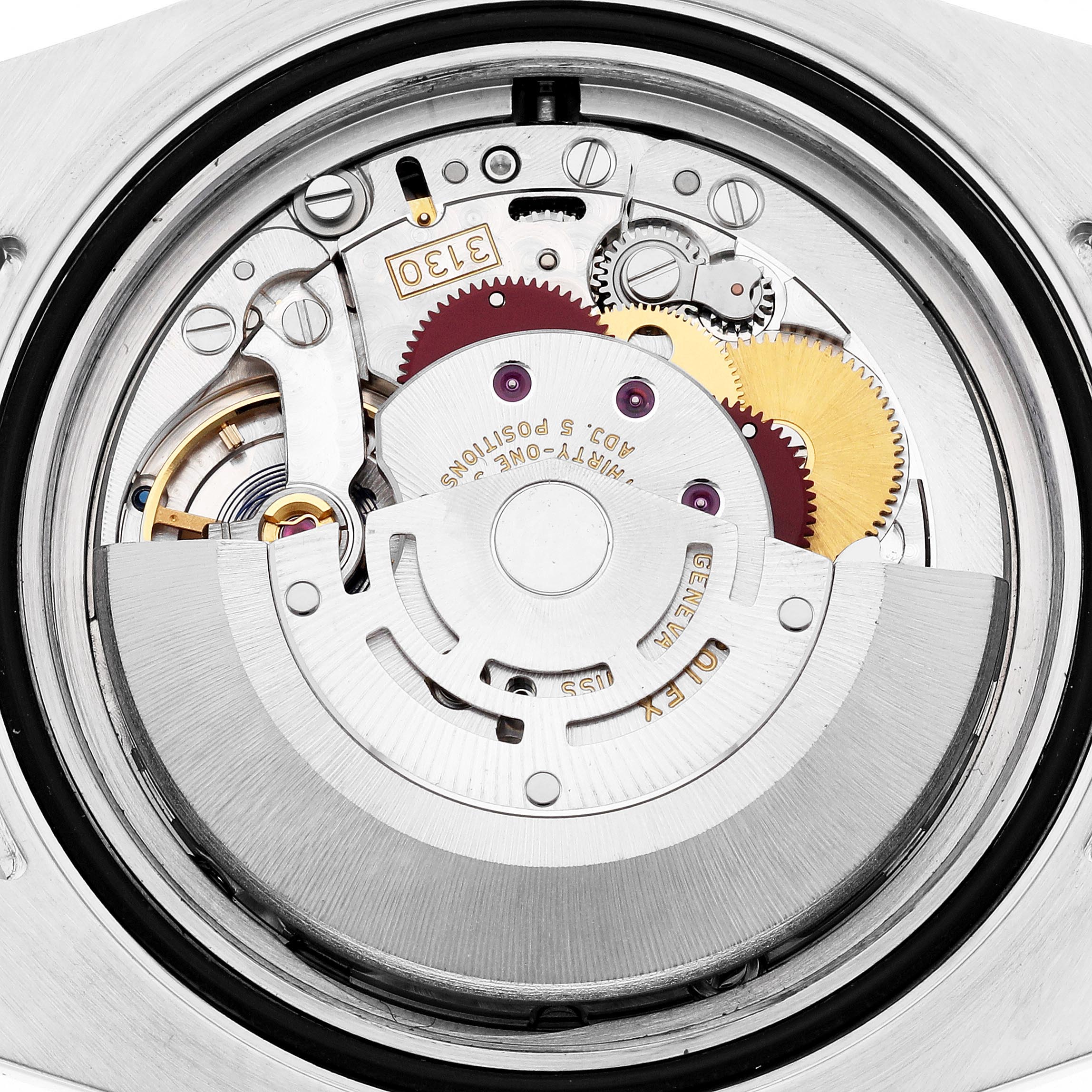 The image shows the movement of a Rolex Submariner 114060 Men's Stainless Steel Black Dial 114060 Men's Stainless Steel Black Dial watch from the back, highlighting gears and the rotor.