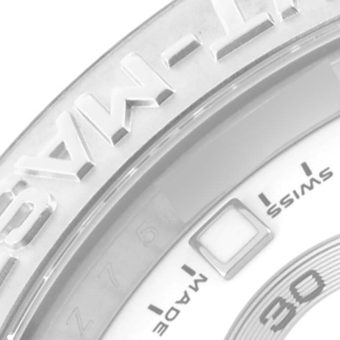 This is a close-up of the bezel and part of the dial of a Rolex Yacht-Master 116689 Men's White Gold White Dial 116689 Men's White Gold White Dial watch.