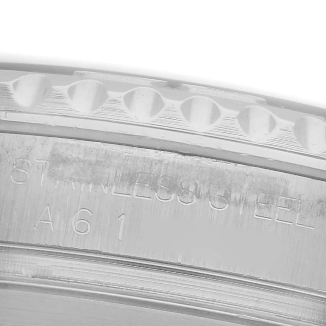 The image shows a close-up angle of the Rolex Yacht-Master 16622 Men's Stainless Steel Silver Dial 16622 Men's Stainless Steel Silver Dial's stainless steel bezel edge and engraved inner rim.