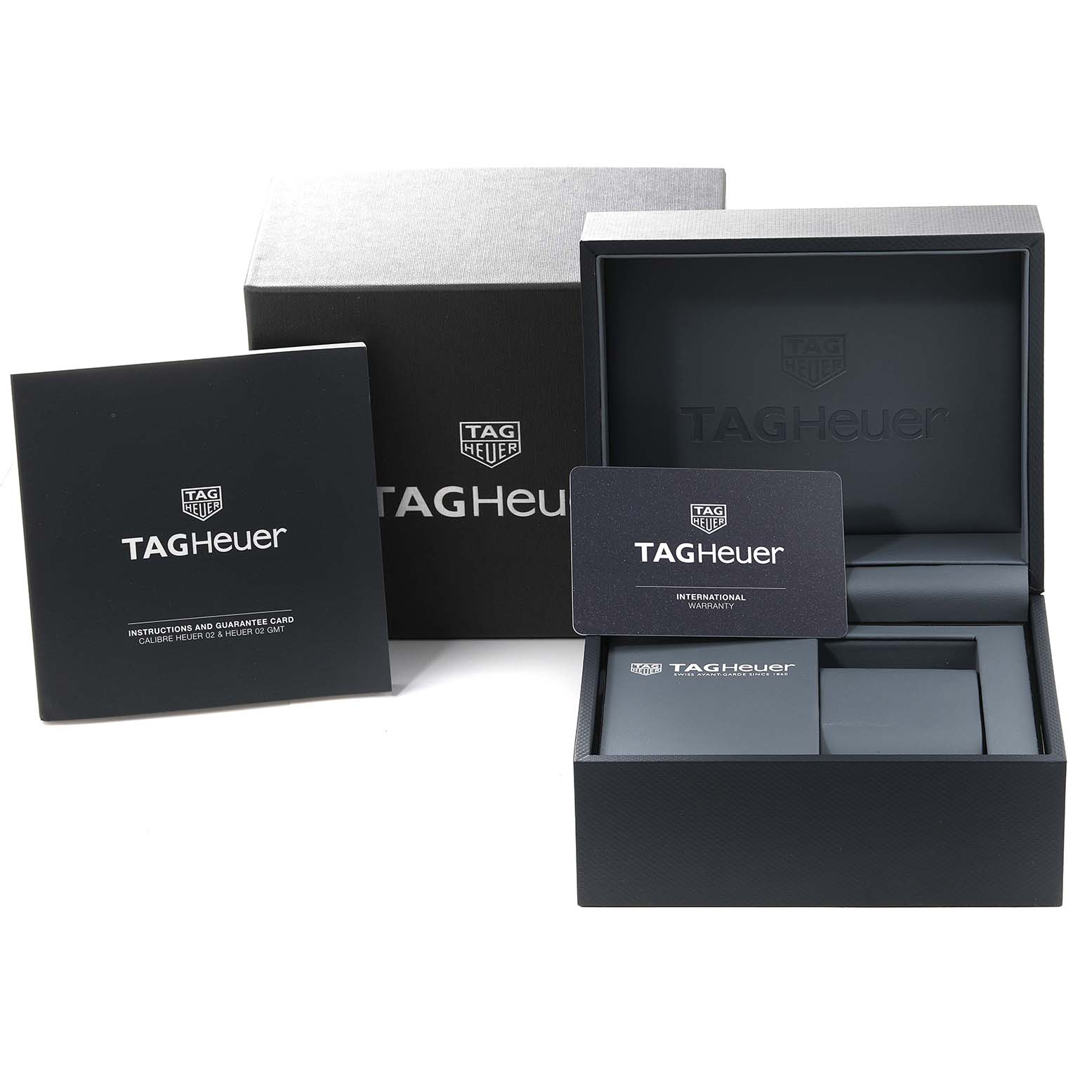 The image shows the Tag Heuer Carrera CBN2A5A.FC6481 Men's Steel and Gold (two tone) Black Dial CBN2A5A.FC6481 Men's Steel and Gold (two tone) Black Dial watch's box, warranty card, and instruction booklet, viewed from the front.