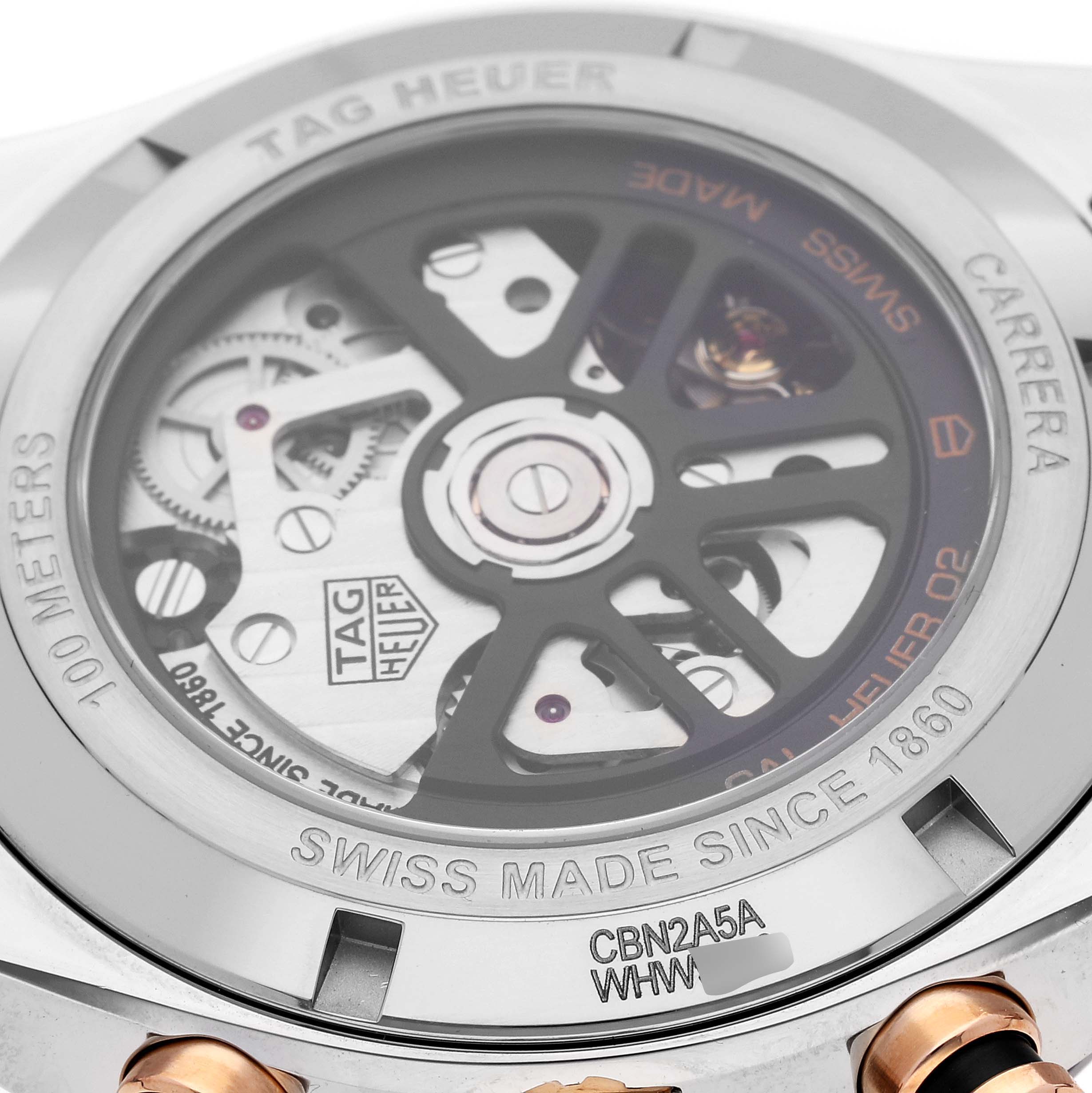 The image shows the back of a Tag Heuer Carrera CBN2A5A.FC6481 Men's Steel and Gold (two tone) Black Dial CBN2A5A.FC6481 Men's Steel and Gold (two tone) Black Dial watch with its visible mechanical movement and engraved details.