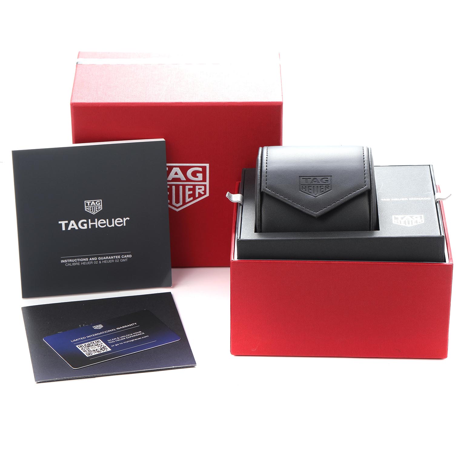 The image shows a Tag Heuer Monaco CBL2183.FT6236 Men's Titanium Black Dial CBL2183.FT6236 Men's Titanium Black Dial watch box set with accessories, including packaging and documentation.