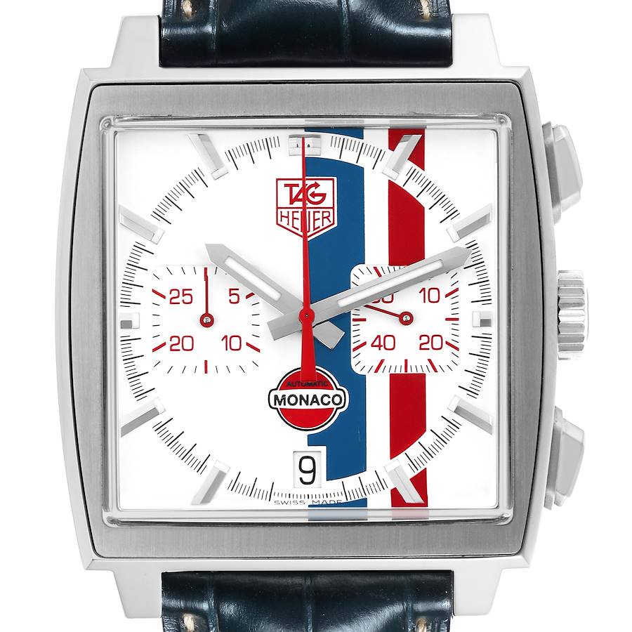 The image shows a front view of a Tag Heuer Monaco watch, highlighting its dial, hands, subdials, and red-blue-white stripe design.