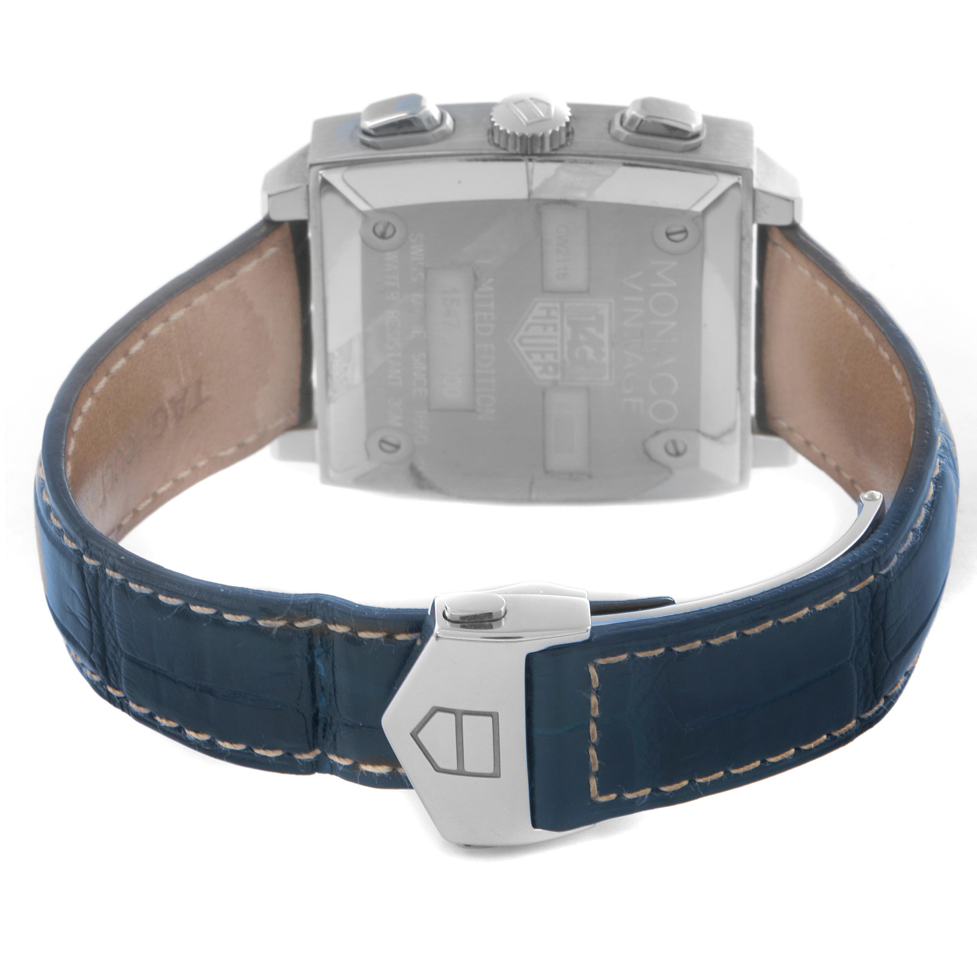 The image shows the back view of the Monaco model by Tag Heuer, featuring the case back, pushers, and clasp of the strap.