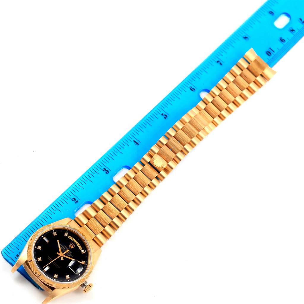 The image shows the entire bracelet and face of the Rolex 18248 Men's Yellow Gold Black Dial 18248 Men's Yellow Gold Black Dial Day-Date President Yellow Gold Black Diamond Dial Men's Watch 18248, alongside a ruler for scale.