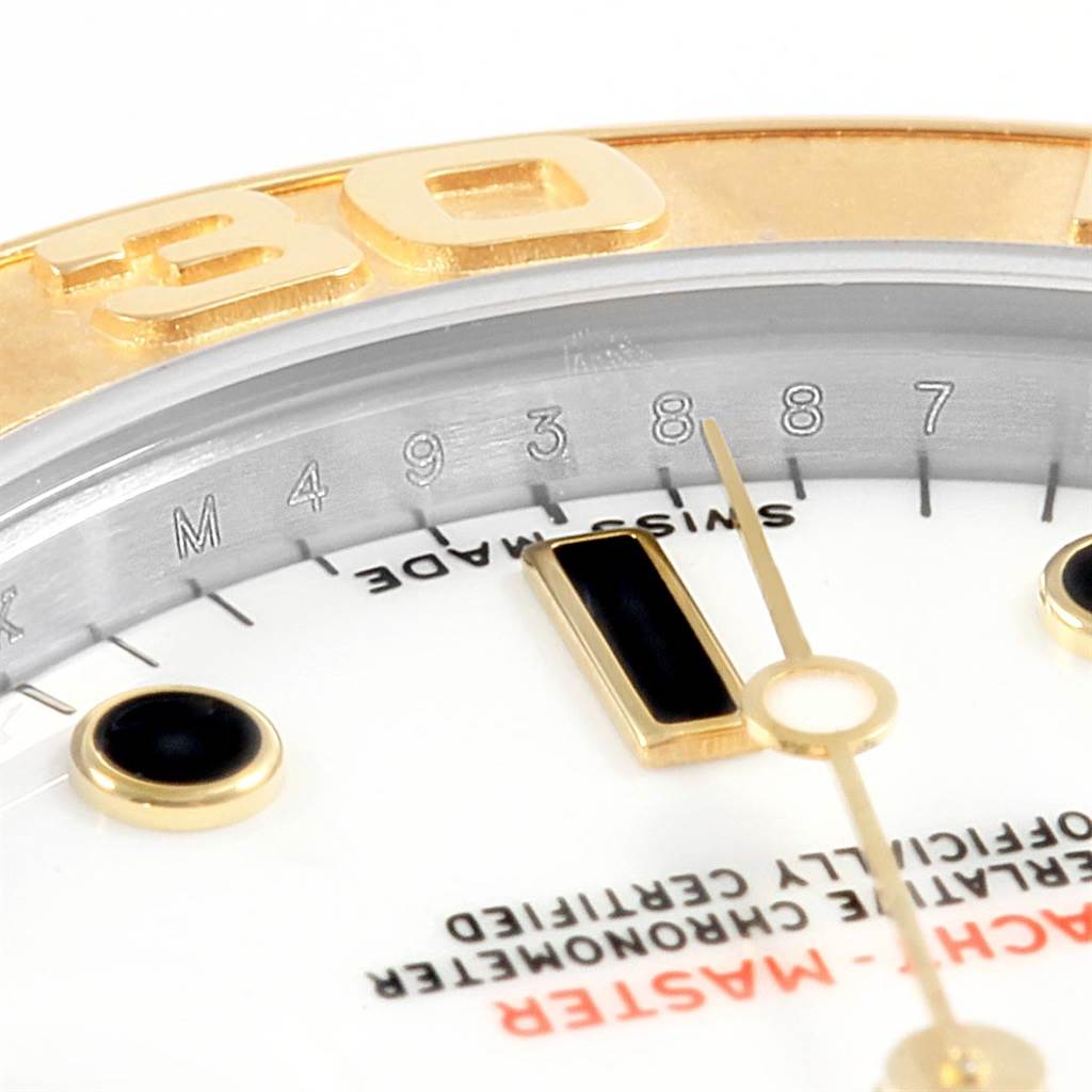 The image shows a close-up of the dial and part of the bezel of the Rolex 168623 Steel and Gold (two tone) White Dial 168623 Steel and Gold (two tone) White Dial Yachtmaster 35 Midsize Steel Yellow Gold Watch 168623.