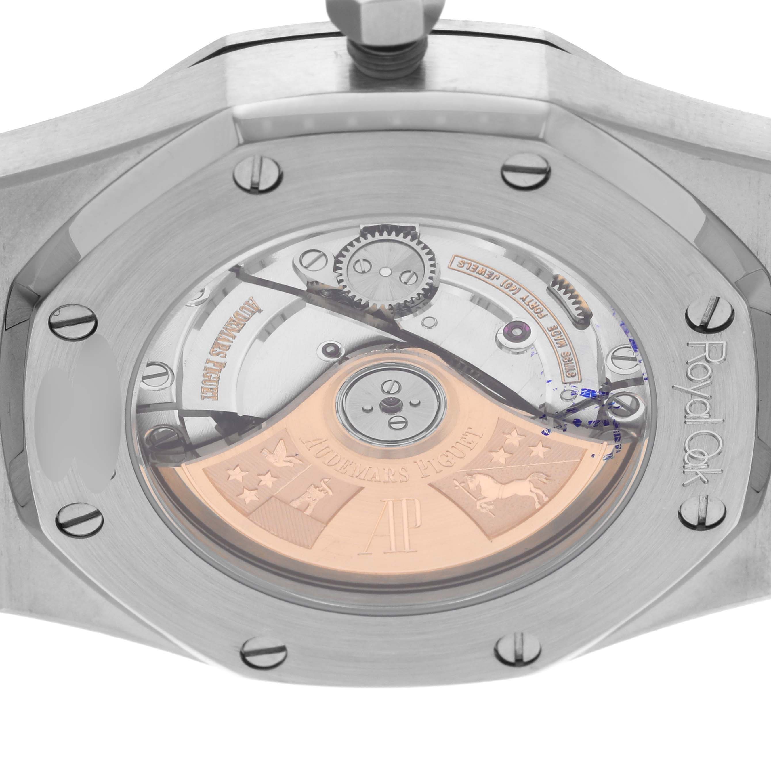 The image shows the caseback of a Royal Oak model by Audemars Piguet, revealing the intricate mechanical movement inside.