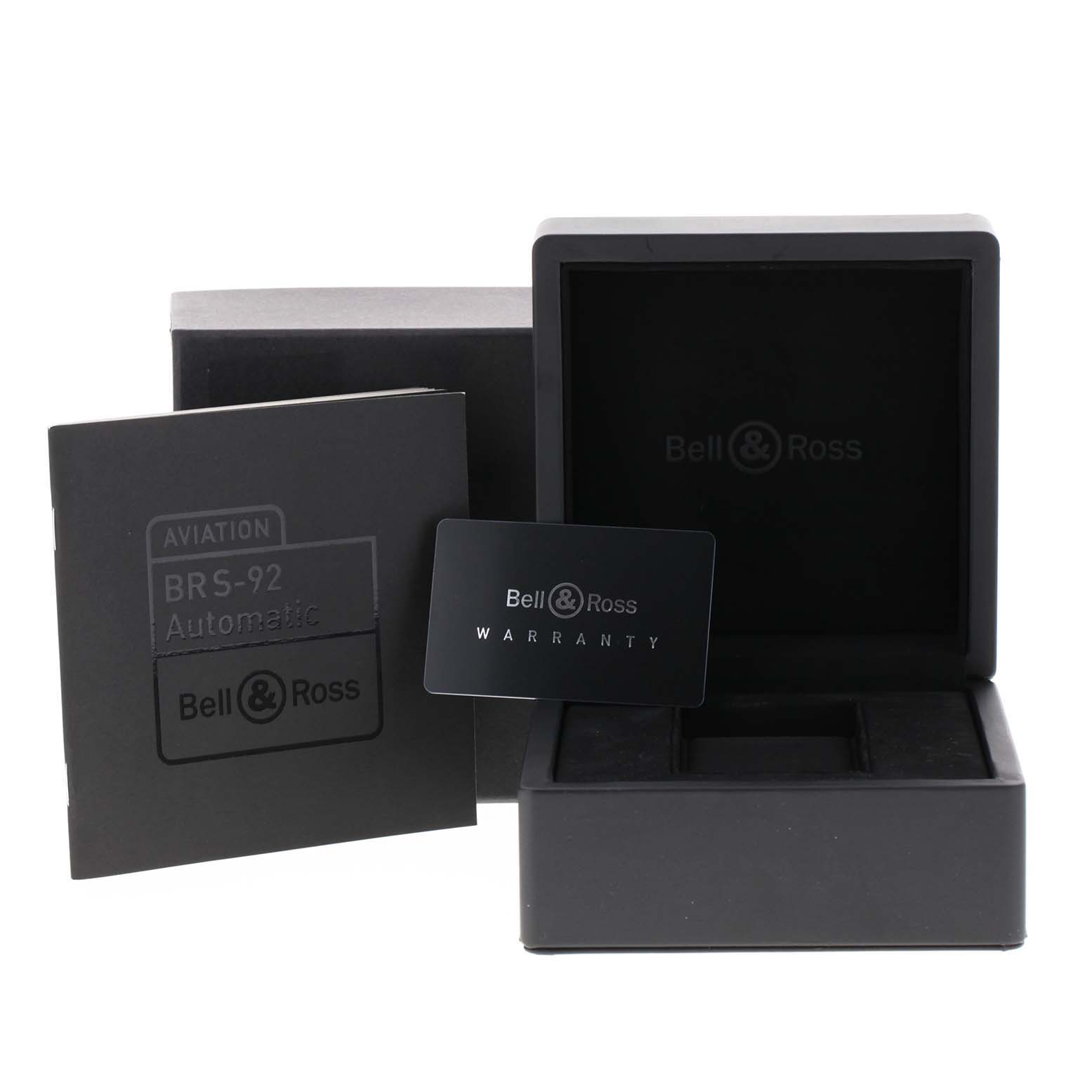 The image shows the box, warranty card, and manual for the Bell 
Ross Officer Black Dial Automatic Steel Men
s Watch BRS92.