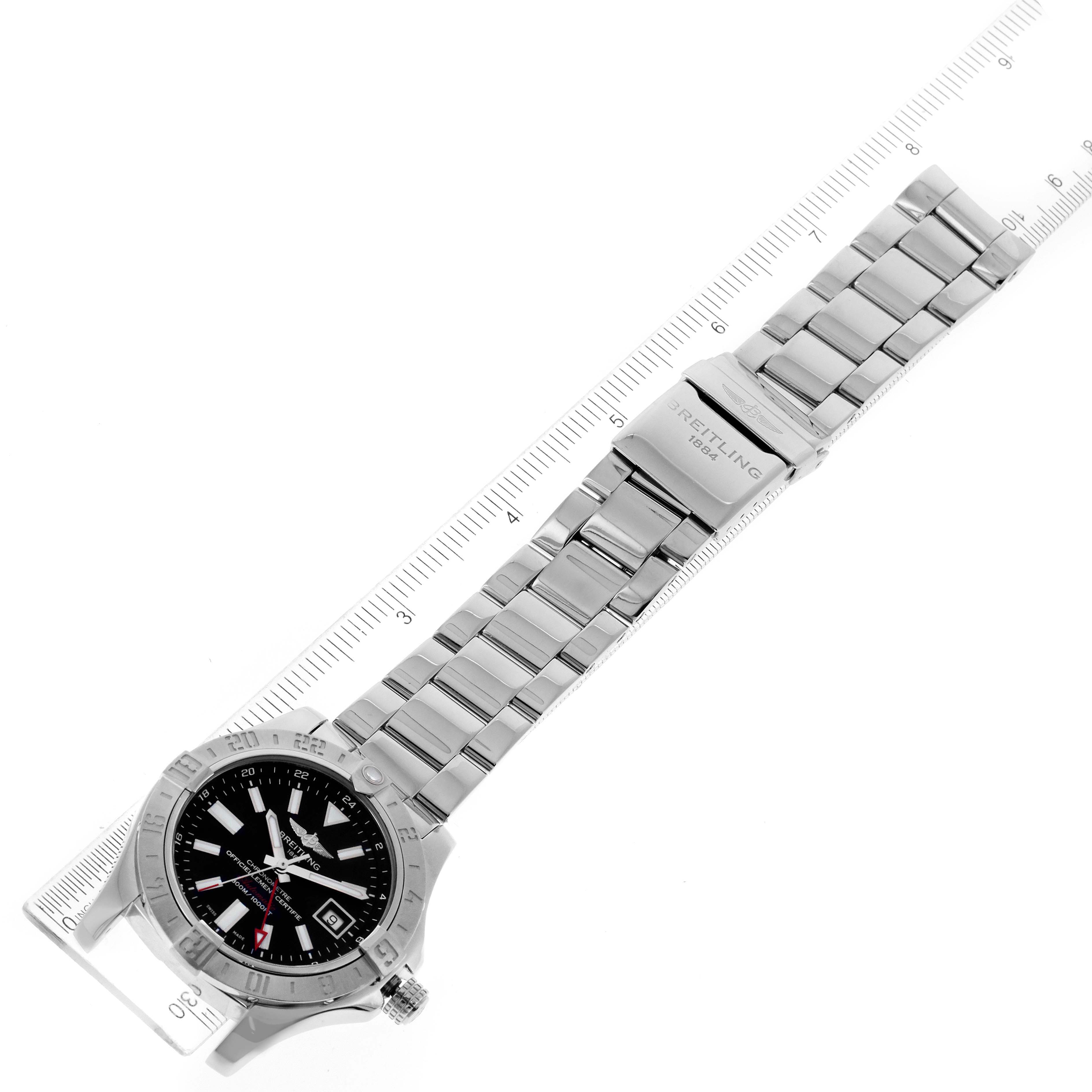 The image shows a top-down view of a Breitling Avenger A3239011-C872-170A Men's Stainless Steel Black Dial A3239011-C872-170A Men's Stainless Steel Black Dial watch, highlighting its face, bezel, and metallic bracelet on a ruler.