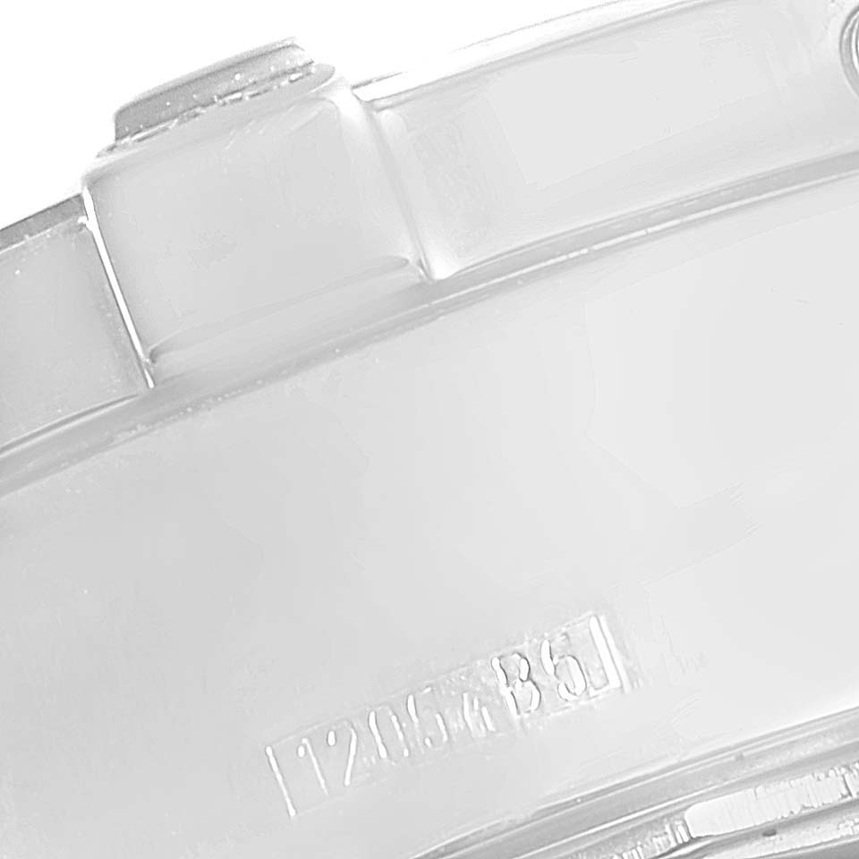 This image shows a close-up of a part of the bezel and case of a Breitling Superocean A13340 Men's Stainless Steel Beige Dial A13340 Men's Stainless Steel Beige Dial watch.