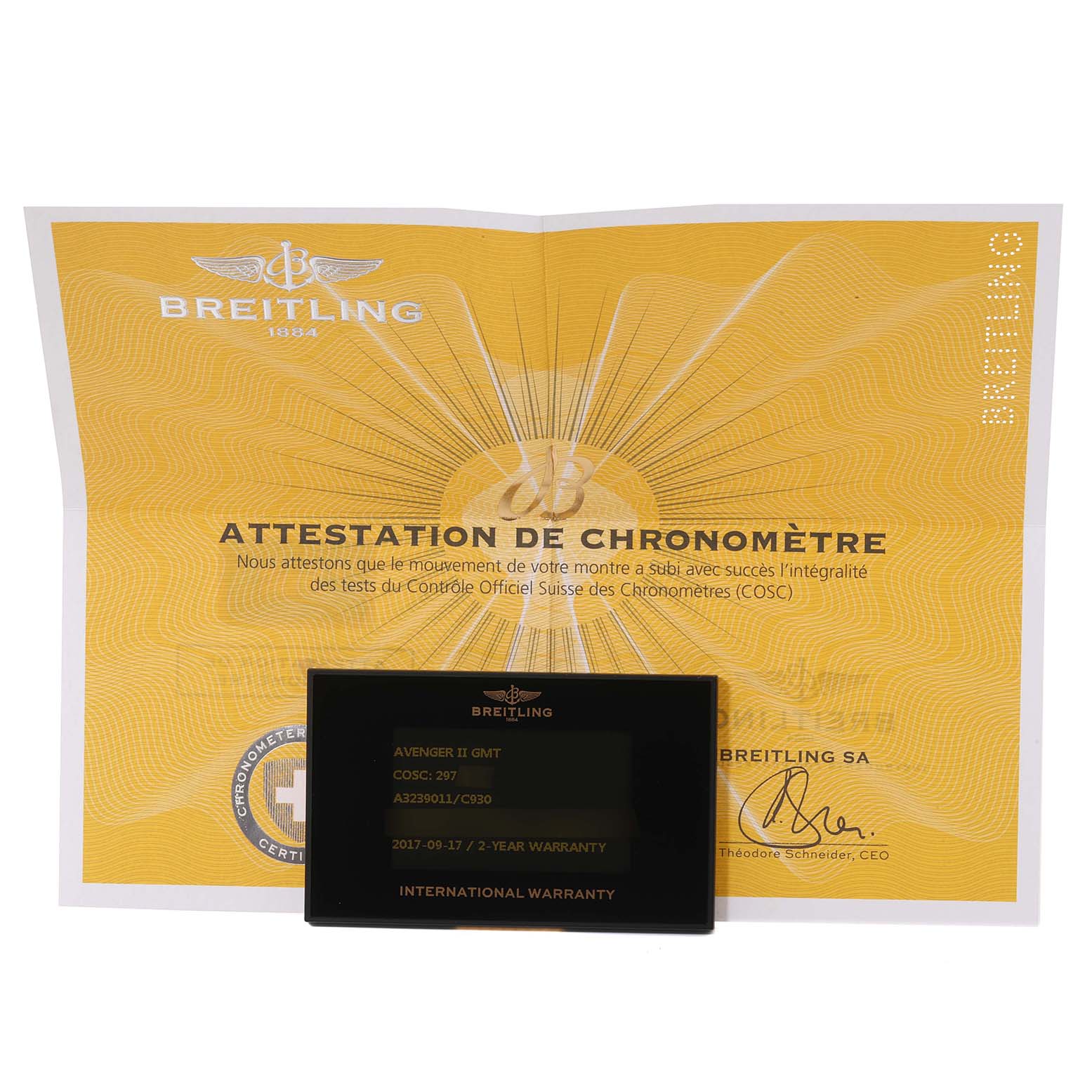 The image shows a Breitling Avenger A3239011/C930 Men's Stainless Steel Mother of Pearl Dial A3239011/C930 Men's Stainless Steel Mother of Pearl Dial model with its chronometer certificate and international warranty card placed in front.