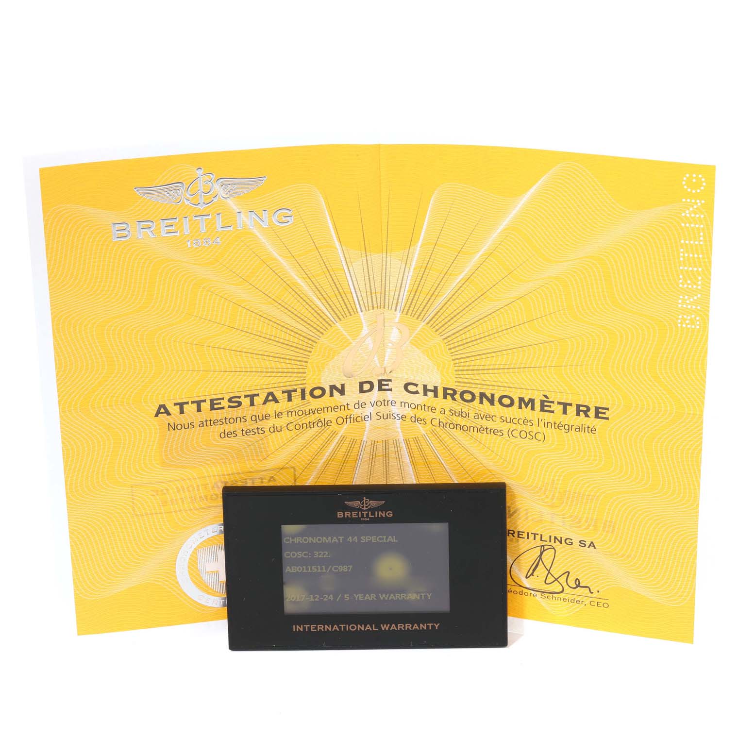 The image shows the warranty card and chronometer certificate for a Breitling Chronomat AB0115 Men
s Stainless Steel Blue Dial AB0115 Men
s Stainless Steel Blue Dial model.