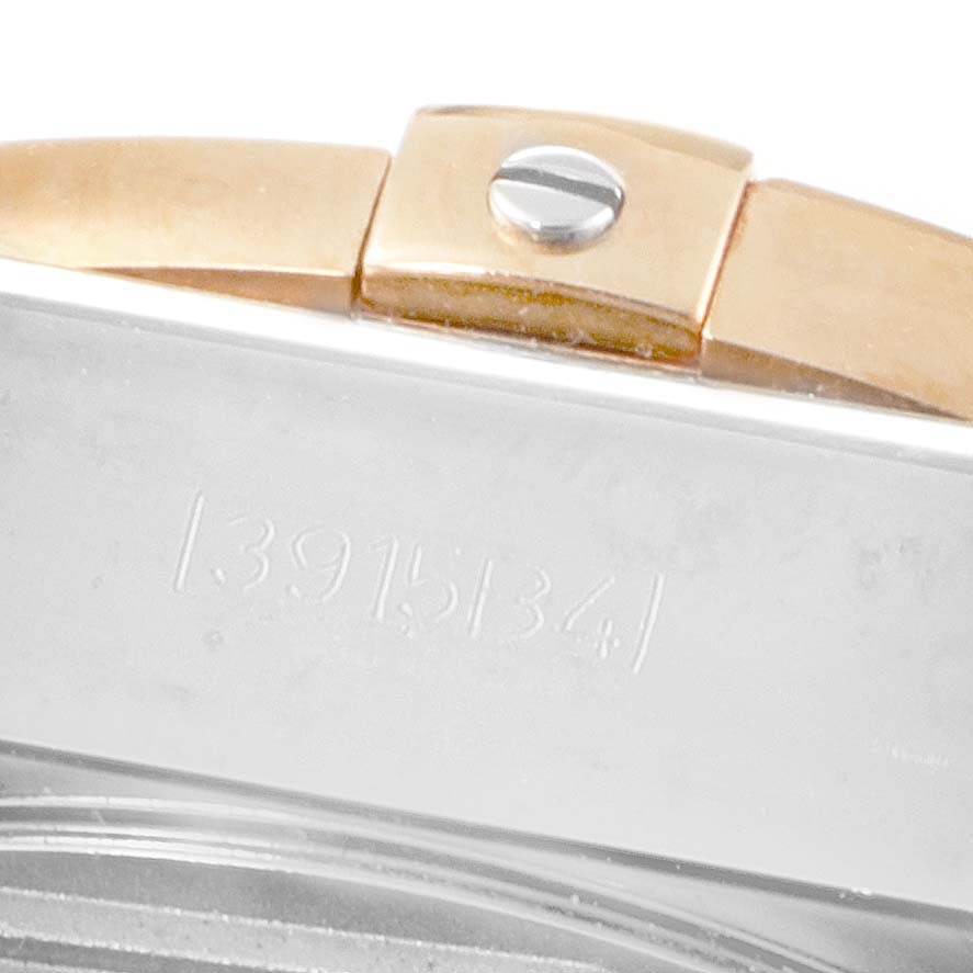 This close-up image of the Breitling Chronomat CB042012/BB86 Men's Steel and Gold (two tone) Blue Dial CB042012/BB86 Men's Steel and Gold (two tone) Blue Dial watch shows part of the band and a portion of the case back with serial engraving.