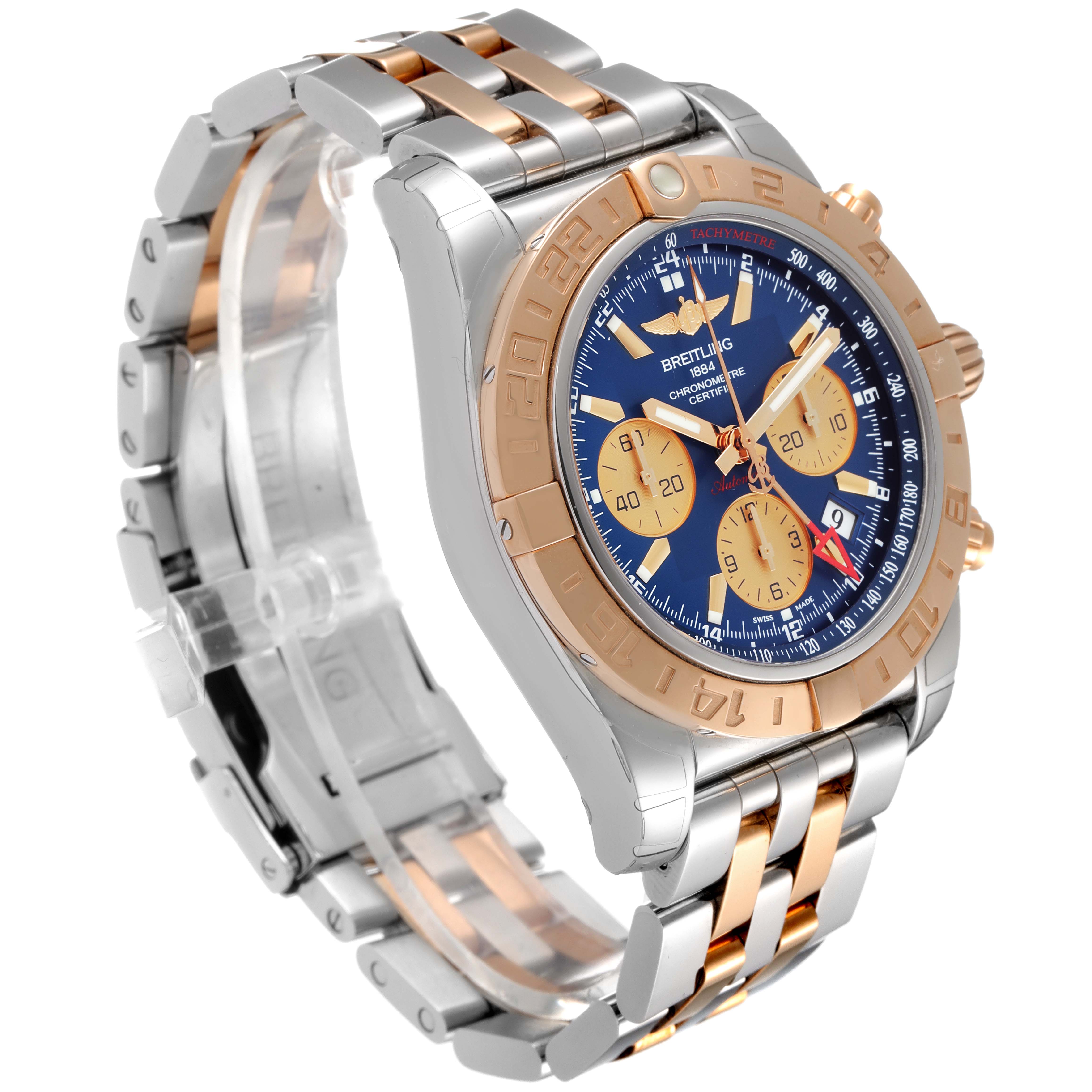 The image shows a Breitling Chronomat CB042012/BB86 Men's Steel and Gold (two tone) Blue Dial CB042012/BB86 Men's Steel and Gold (two tone) Blue Dial watch angled to display its face, bezel, and metal two-tone bracelet.