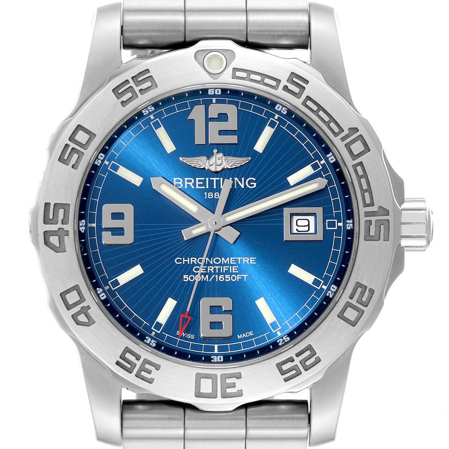 The image shows a front view of a Breitling Colt watch, highlighting its blue dial, bezel, and metal bracelet.