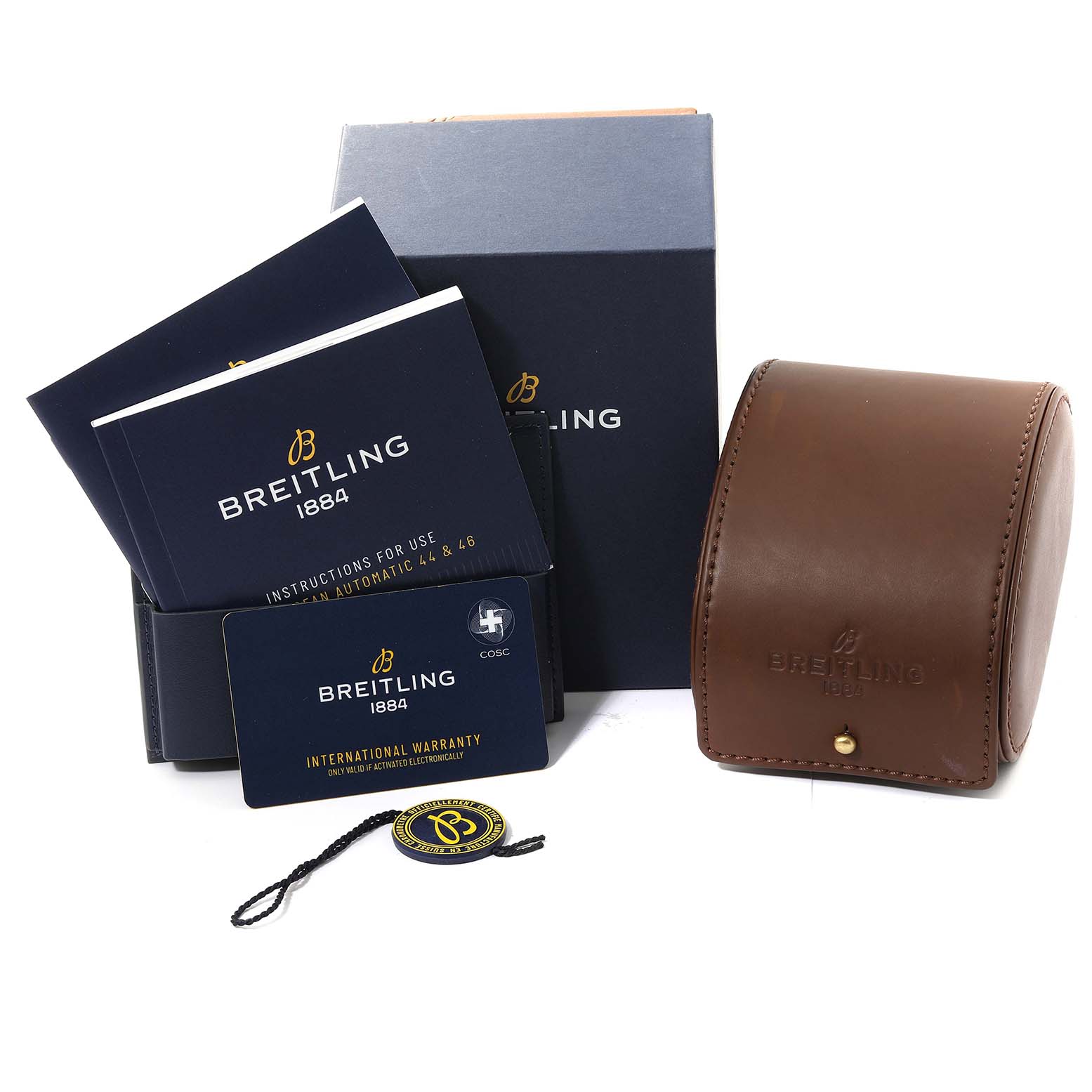 The image shows accessories for the Breitling Superocean M17368 Men's Stainless Steel Blue Dial M17368 Men's Stainless Steel Blue Dial model, including manuals, warranty card, hang tag, and watch case.