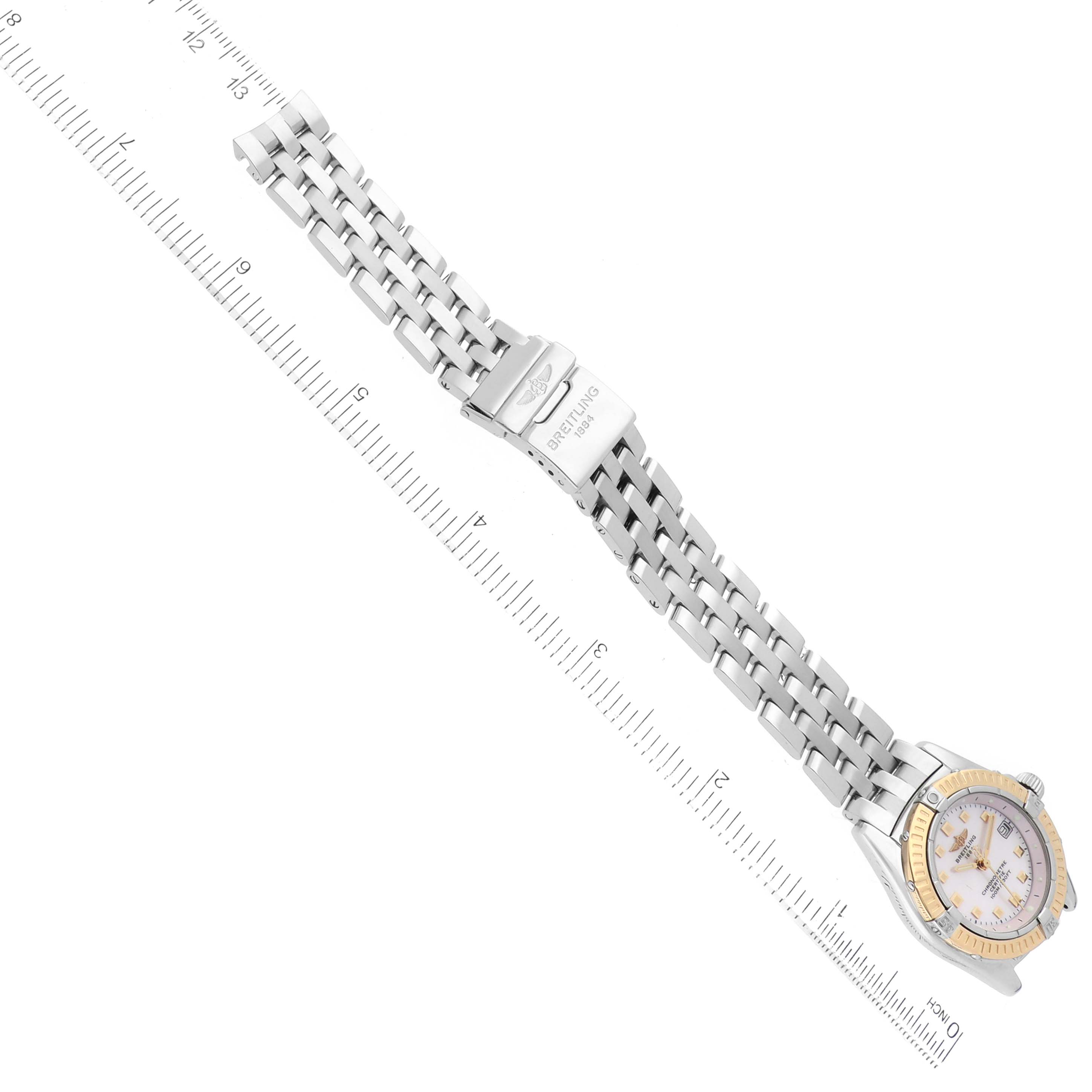 The image shows the Breitling D72345 Women's Stainless Steel Mother of Pearl Dial D72345 Women's Stainless Steel Mother of Pearl Dial Windrider Calisto Steel Yellow Gold Diamond Ladies Watch D72345 laid flat with a focus on its bracelet and clasp.