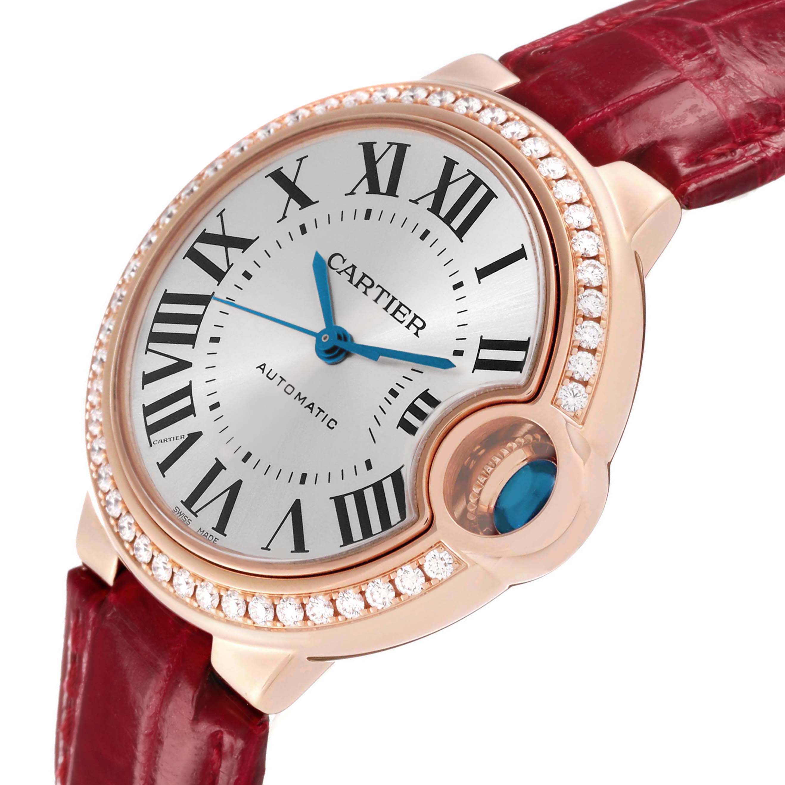 The Cartier Ballon Bleu WJBB0033 Women's Rose Gold Silver Dial watch is shown at an angled view, highlighting the dial, diamond-set bezel, and red leather strap.