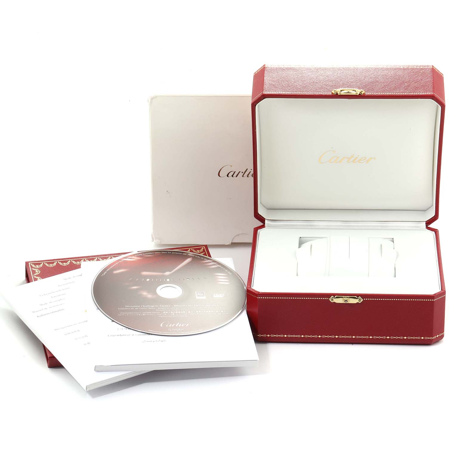 This image shows an open Cartier Ballon Bleu W69005Z2  Men's Yellow Gold Silver Dial W69005Z2  Men's Yellow Gold Silver Dial watch box with its accessories, including a CD and papers, photographed from the front.