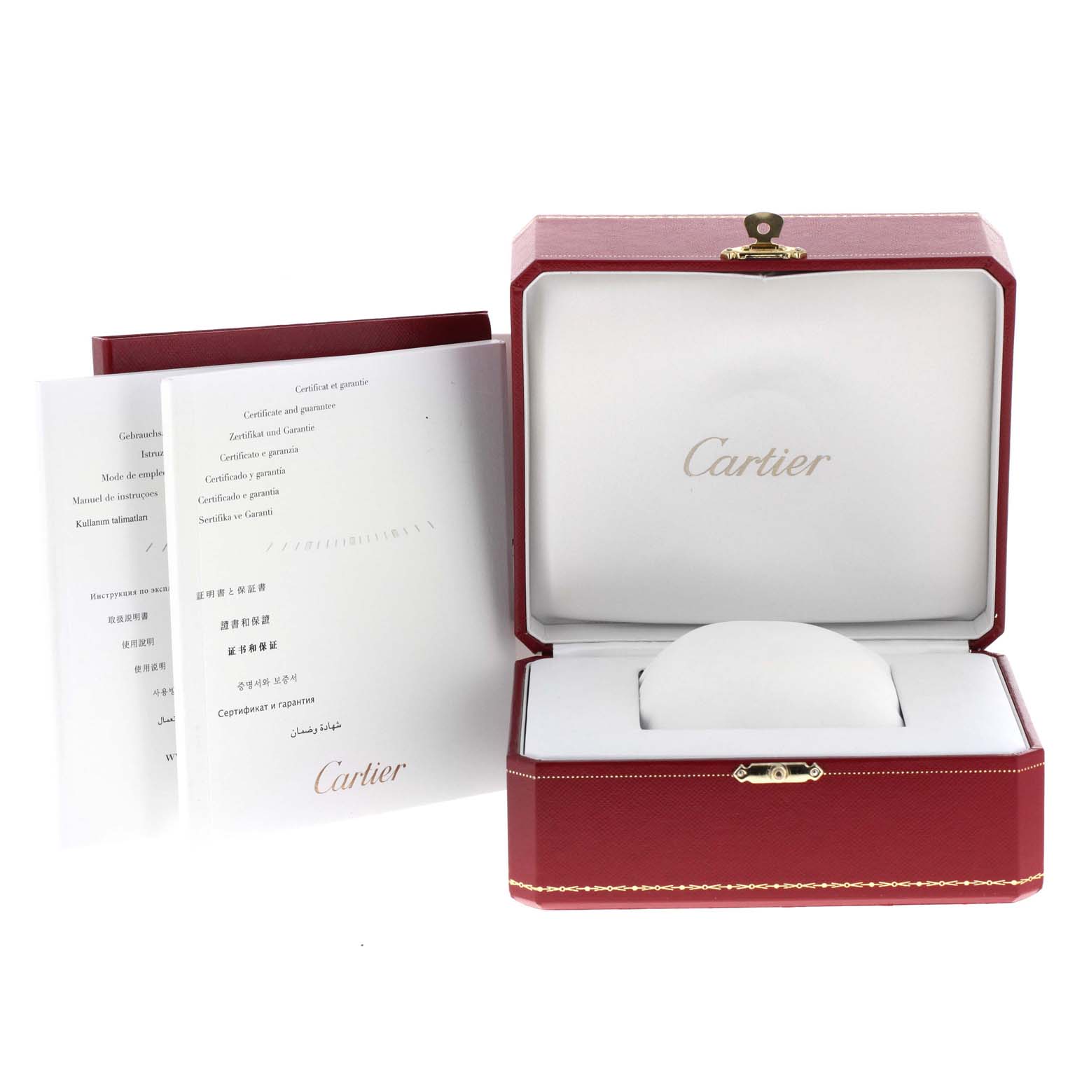 The image shows the packaging box and manuals for the Calibre de Cartier watch by Cartier.