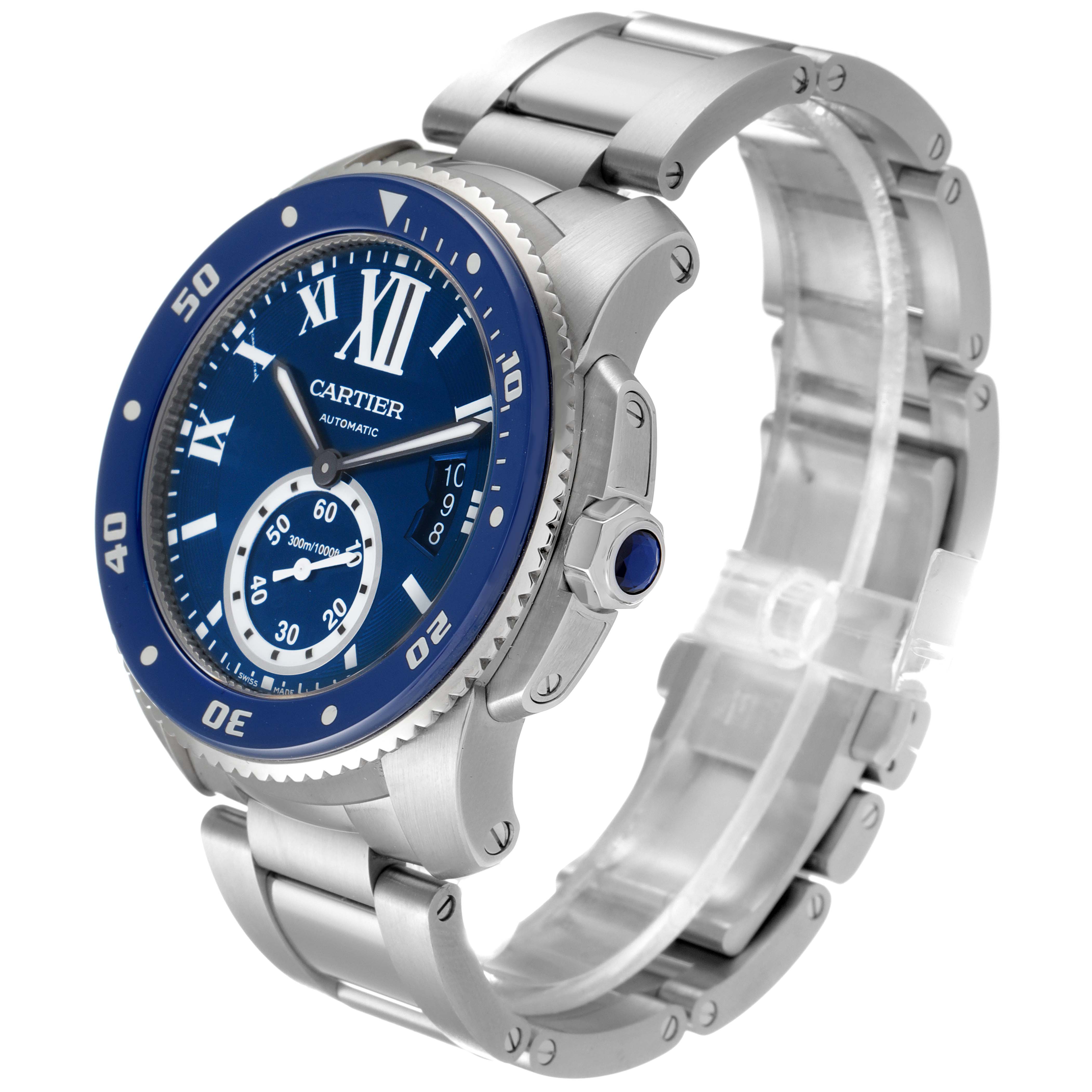 The image shows a Calibre de Cartier watch by Cartier at a three-quarter angle, highlighting the face, bezel, crown, and bracelet.