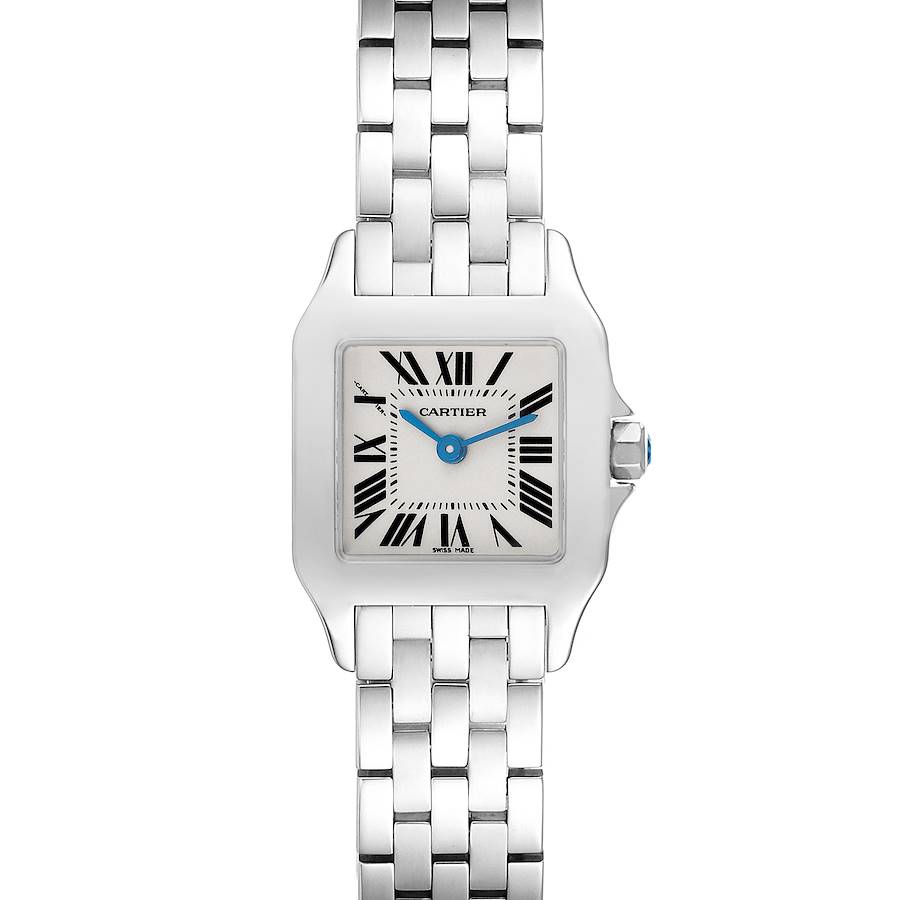 The Cartier Santos Demoiselle watch is shown from the front, featuring its square face, Roman numeral markers, and metal bracelet.