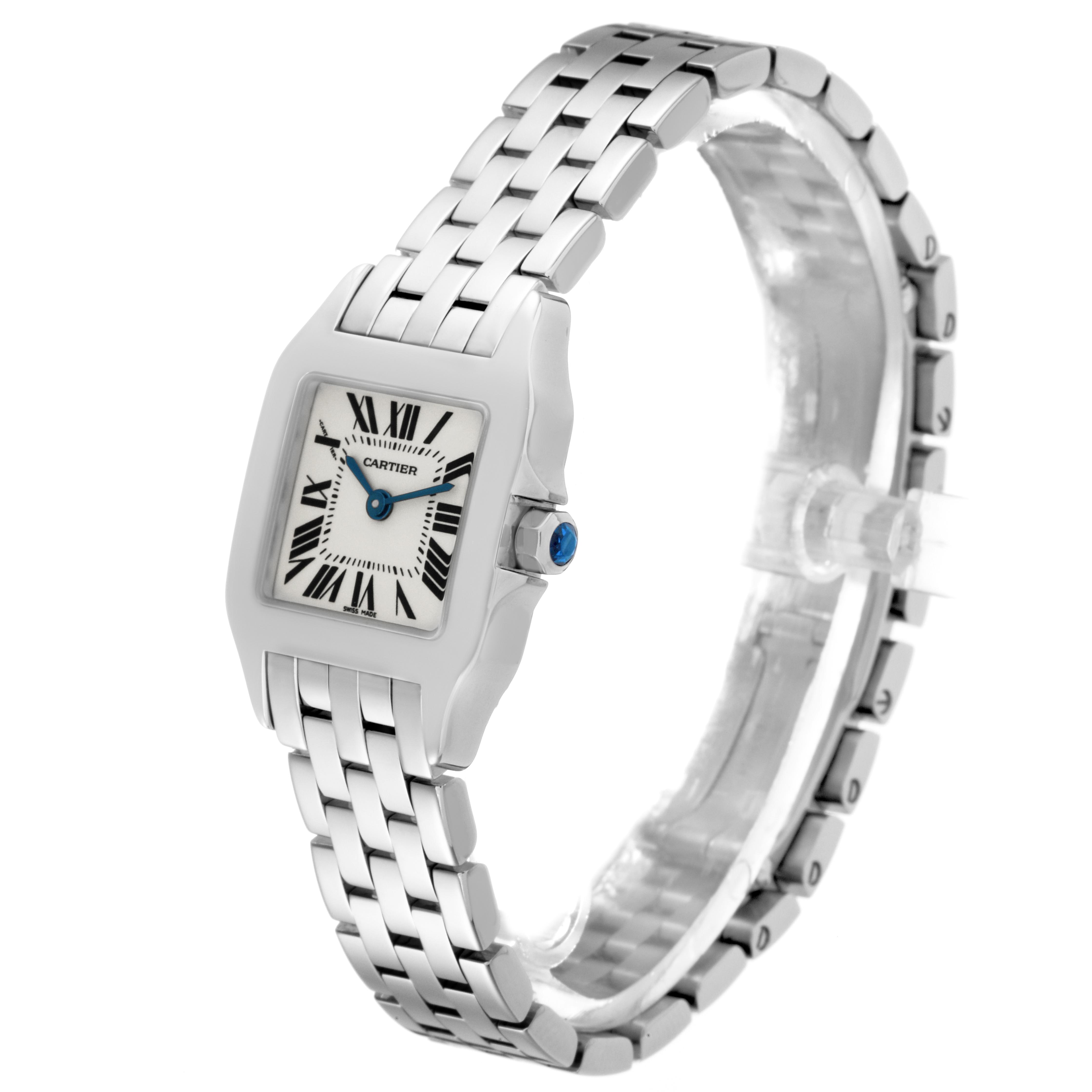 The Cartier Santos Demoiselle W25064Z5 Women's Stainless Steel Silver Dial W25064Z5 Women's Stainless Steel Silver Dial watch is shown at a three-quarter angle, highlighting the face, bracelet, and crown with a blue gemstone.