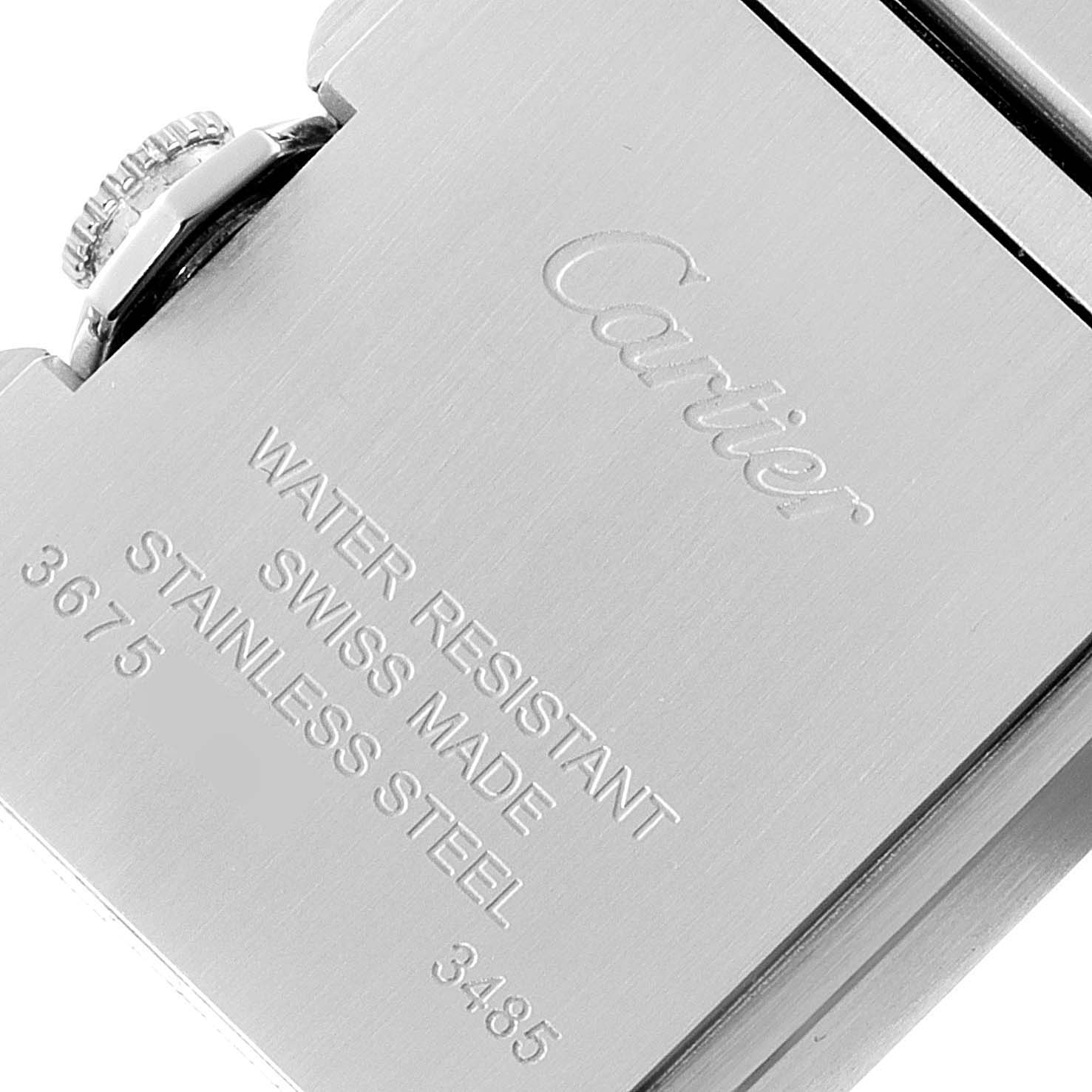 The image shows the back case of a Cartier Tank Anglaise W5310022 Women's Stainless Steel Silver Dial W5310022 Women's Stainless Steel Silver Dial watch, highlighting the crown and engraved specifications.