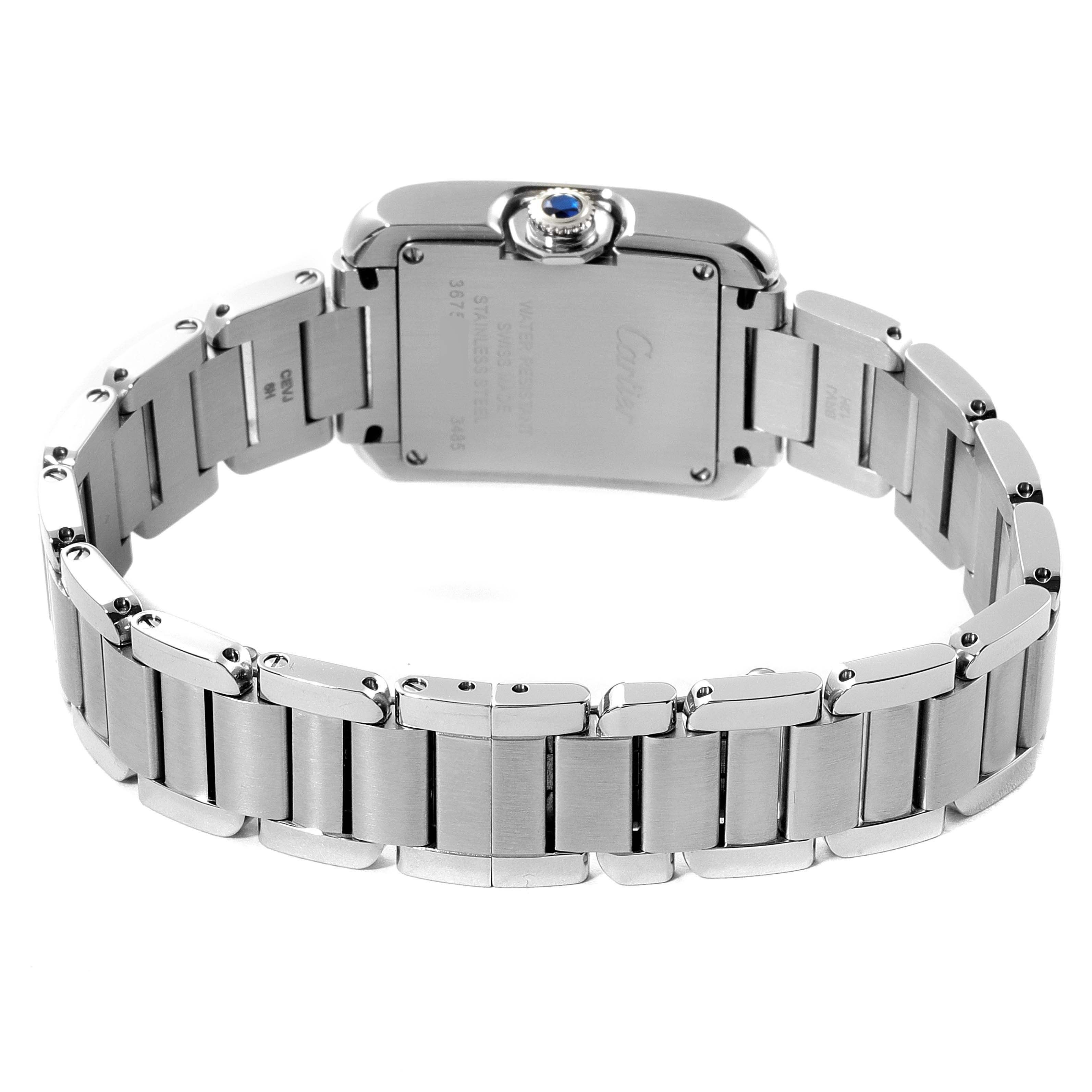 The Tank Anglaise by Cartier is shown from the back, displaying the case back, crown, and metal bracelet.