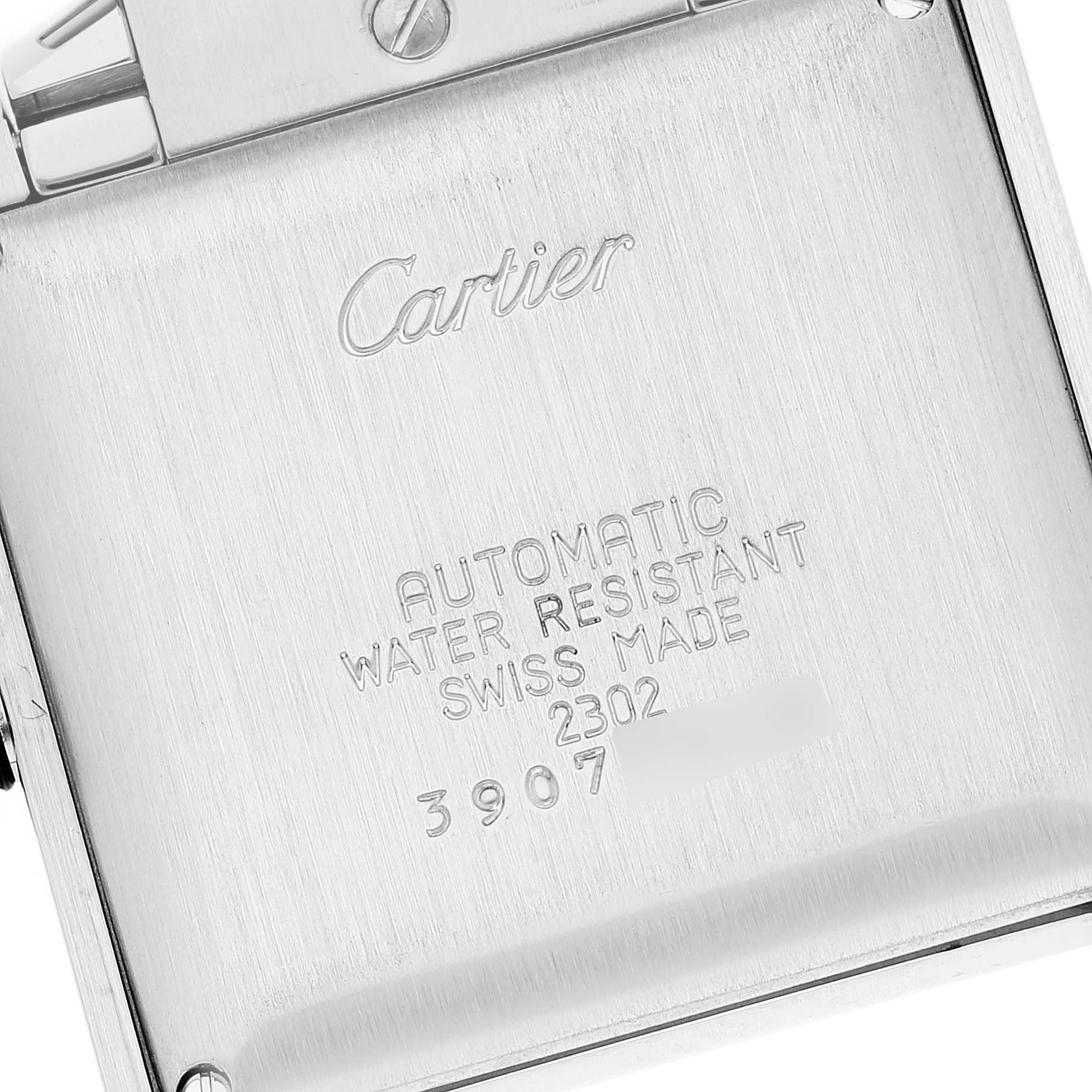 This image shows the back casing of a Cartier Tank Francaise W51005Q4 Men
s Steel and Gold (two tone) Silver Dial W51005Q4 Men
s Steel and Gold (two tone) Silver Dial watch, displaying engravings and some screws.