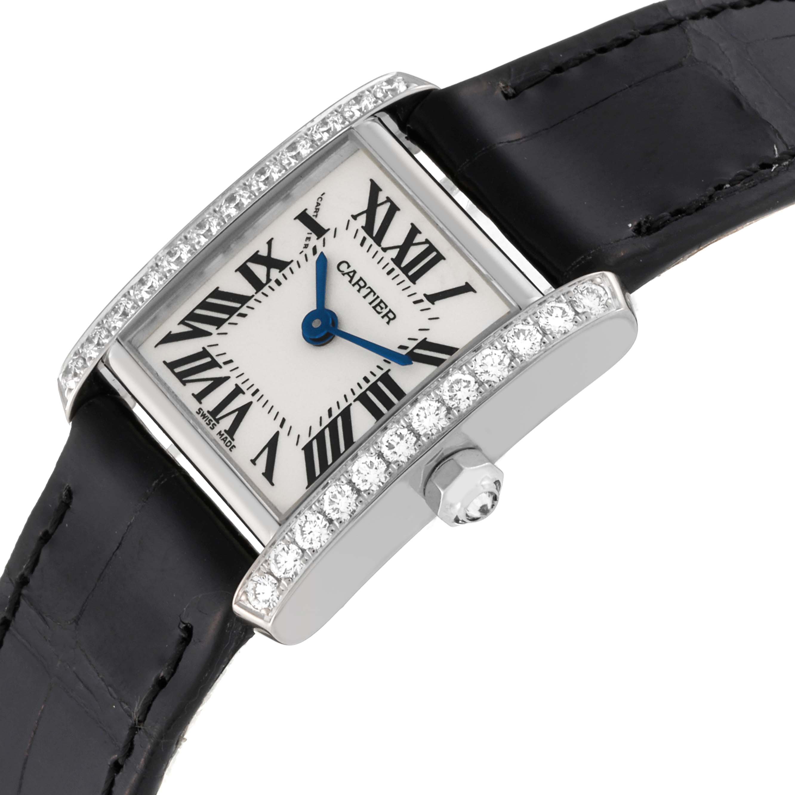 The Cartier Tank Française is shown at an angled view, displaying the face, diamond-set bezel, crown, and black strap.