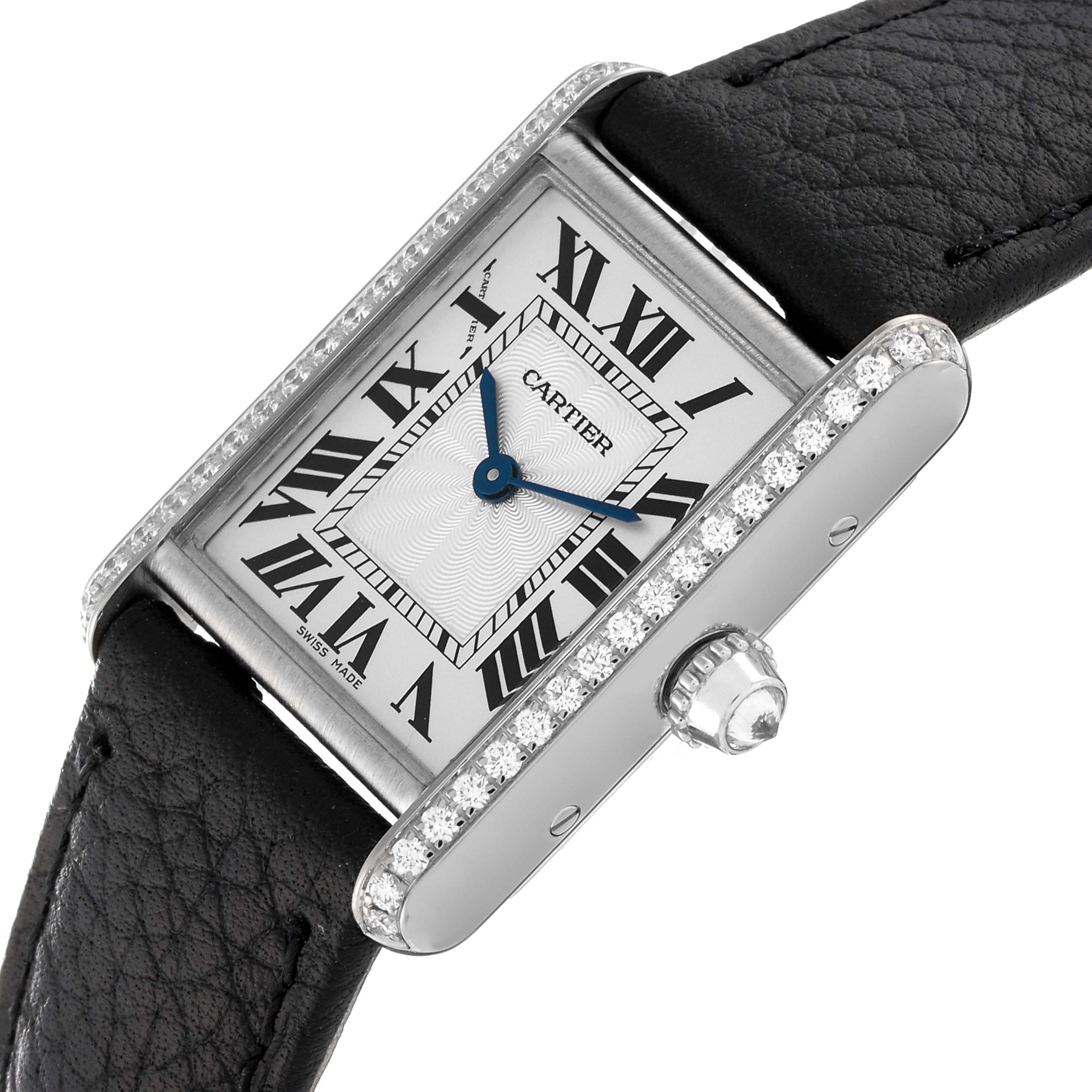 The image shows a Cartier Tank Louis WJTA0011 Women's White Gold Silver Dial WJTA0011 Women's White Gold Silver Dial watch tilted at an angle displaying its face, diamond-set bezel, and a portion of the leather strap.