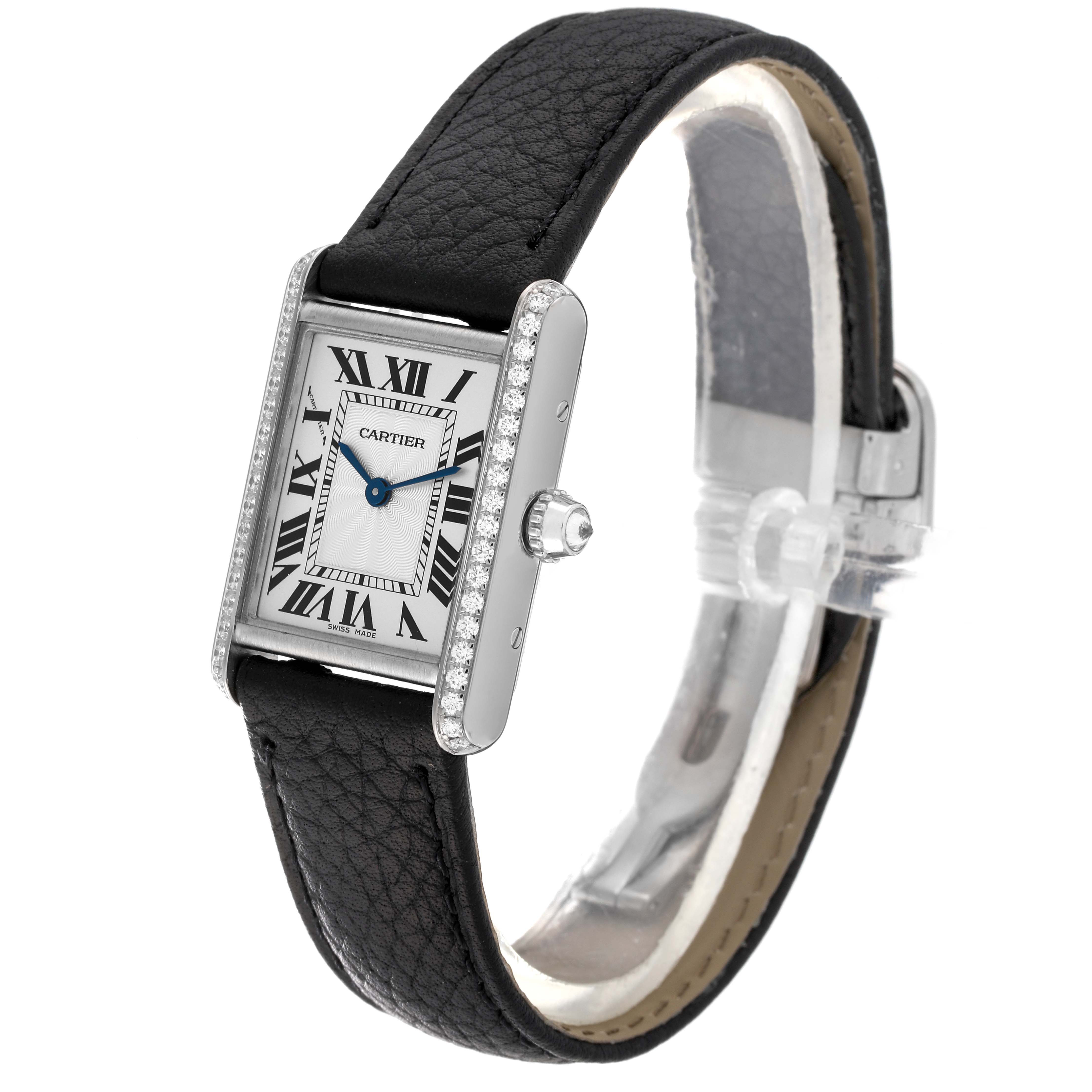 The image shows a Tank Louis Cartier watch at a three-quarter angle, highlighting the face, black leather strap, and side profile.