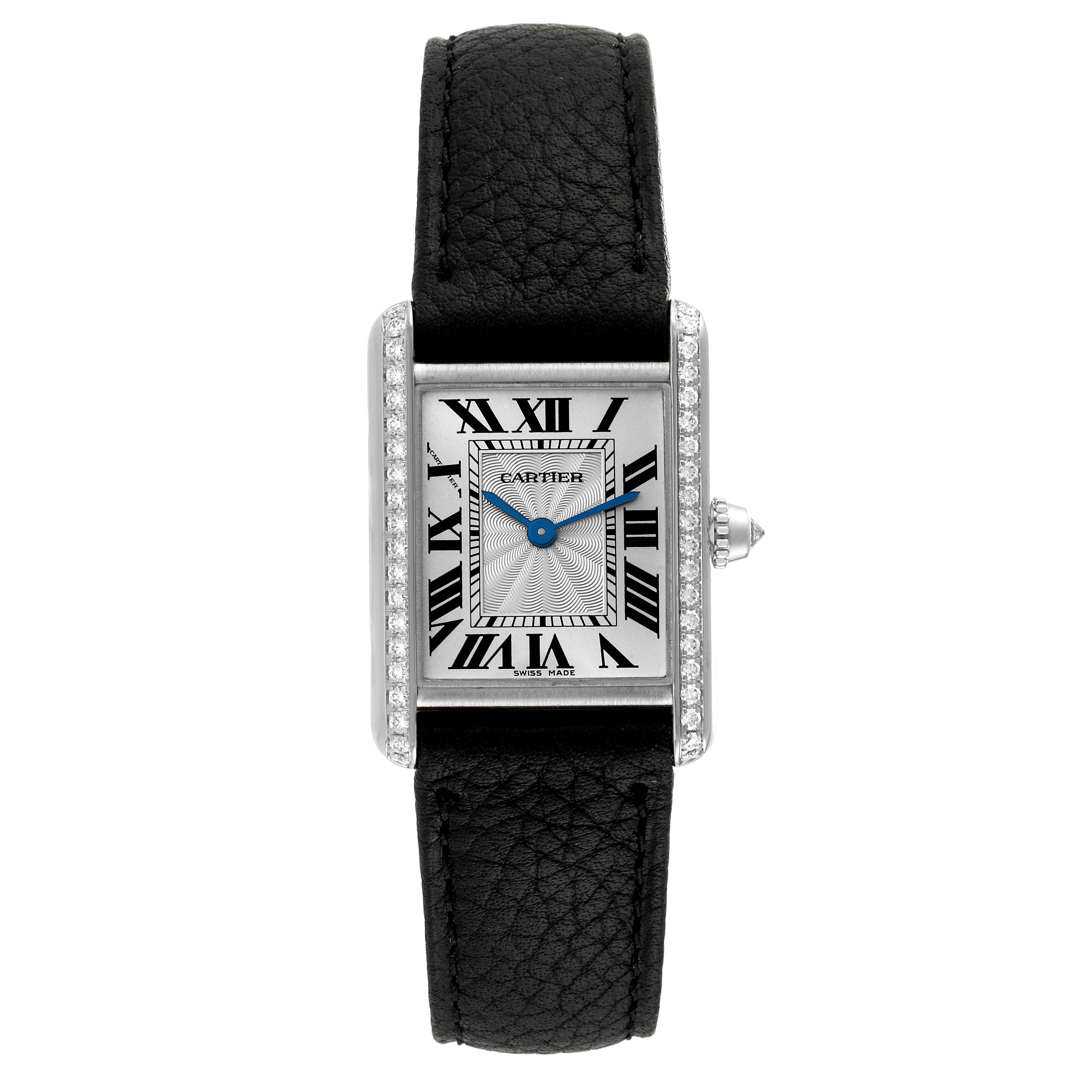 The image shows a top-down view of the Cartier Tank Louis WJTA0011 Women's White Gold Silver Dial WJTA0011 Women's White Gold Silver Dial model watch, highlighting its rectangular face, Roman numerals, and black leather strap.
