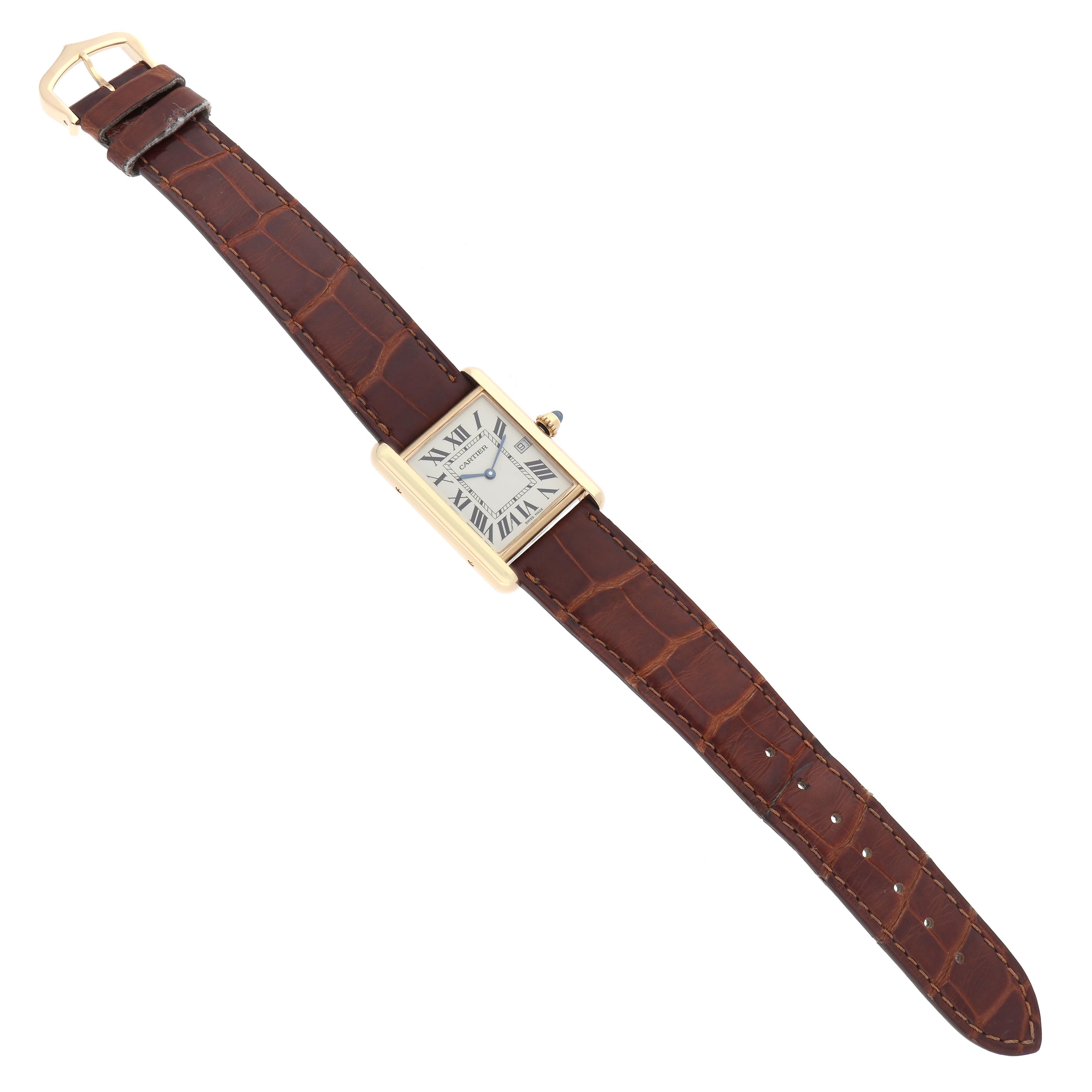 The Cartier Tank Louis W1529756 Men's Yellow Gold Silver Dial W1529756 Men's Yellow Gold Silver Dial watch is shown from a top view, displaying its rectangular case and brown leather strap.